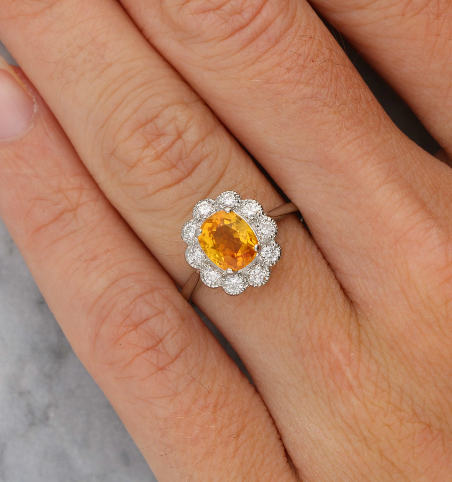 Platinum orange sapphire and diamond cluster ring