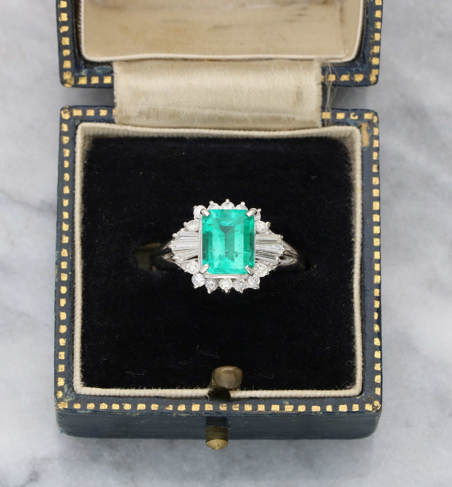 Platinum emerald and diamond cluster ring