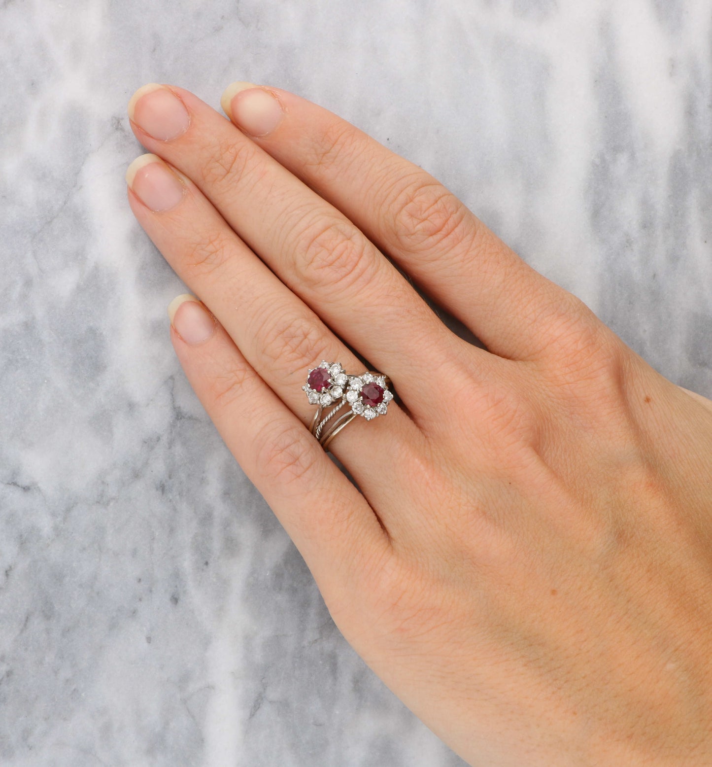 Ruby and diamond cluster crossover ring