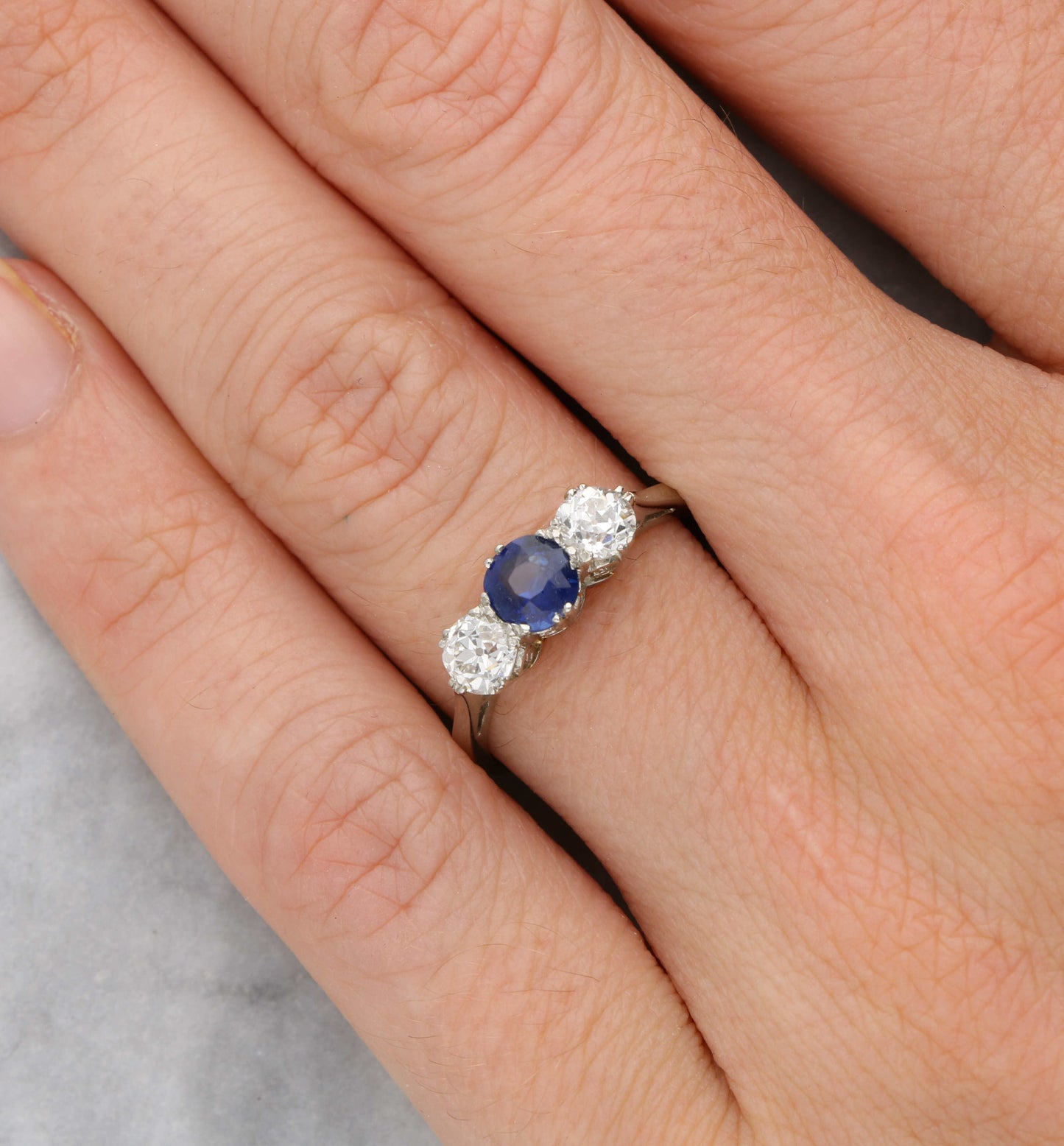 Platinum sapphire and old cut diamond 3 stone engagement ring