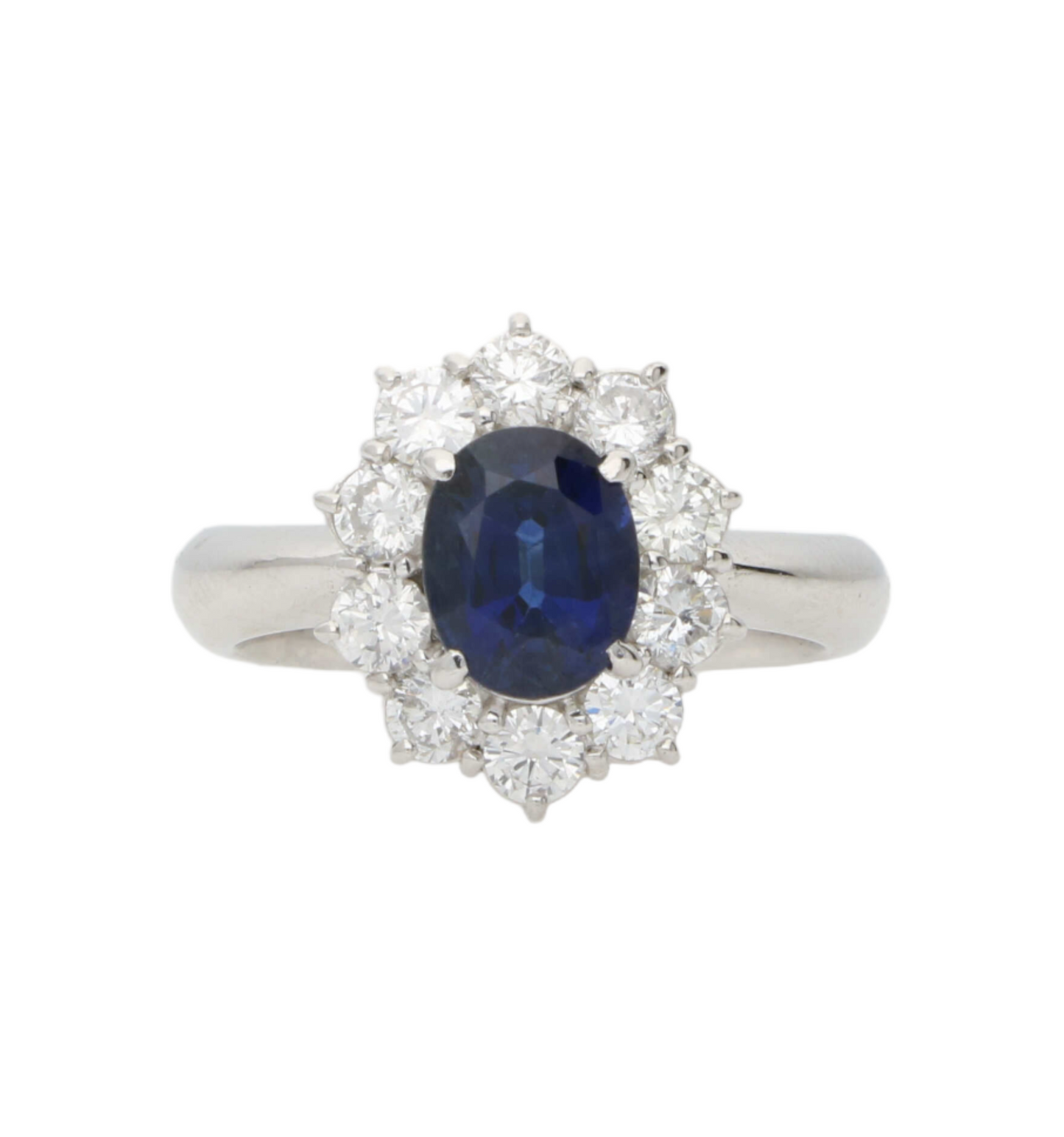 Platinum sapphire and diamond cluster engagement ring
