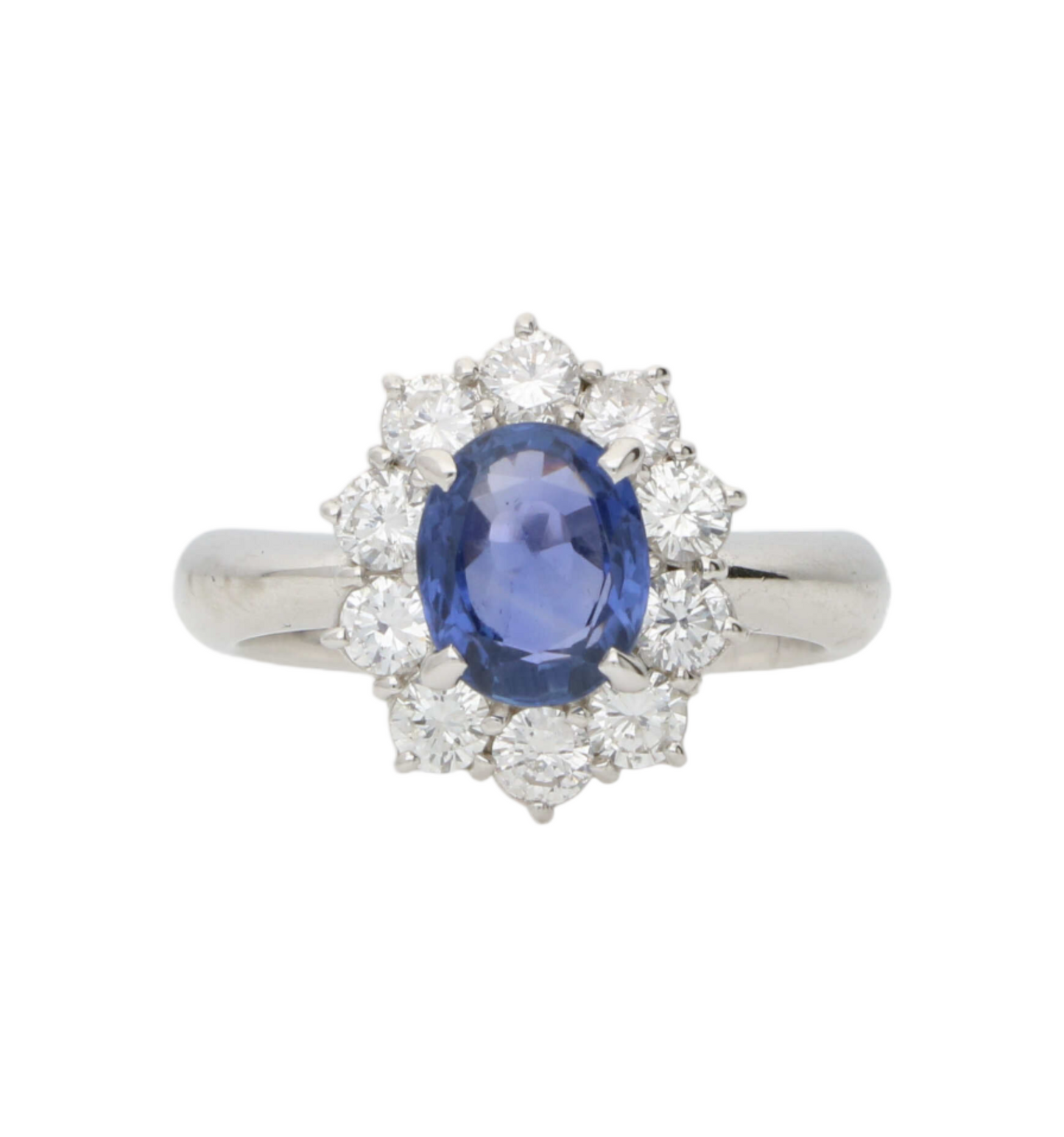 Platinum sapphire and diamond cluster engagement ring