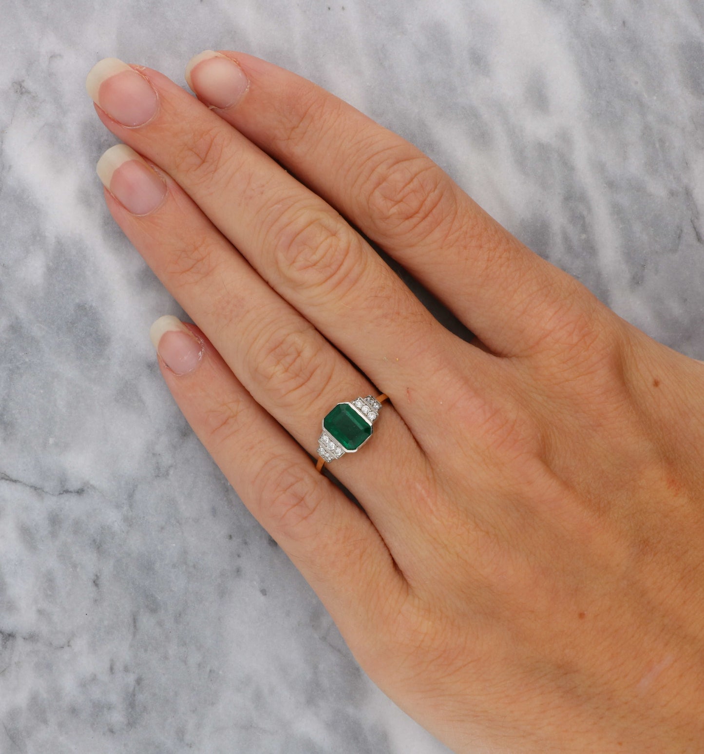 18ct rose gold emerald and diamond engagement ring