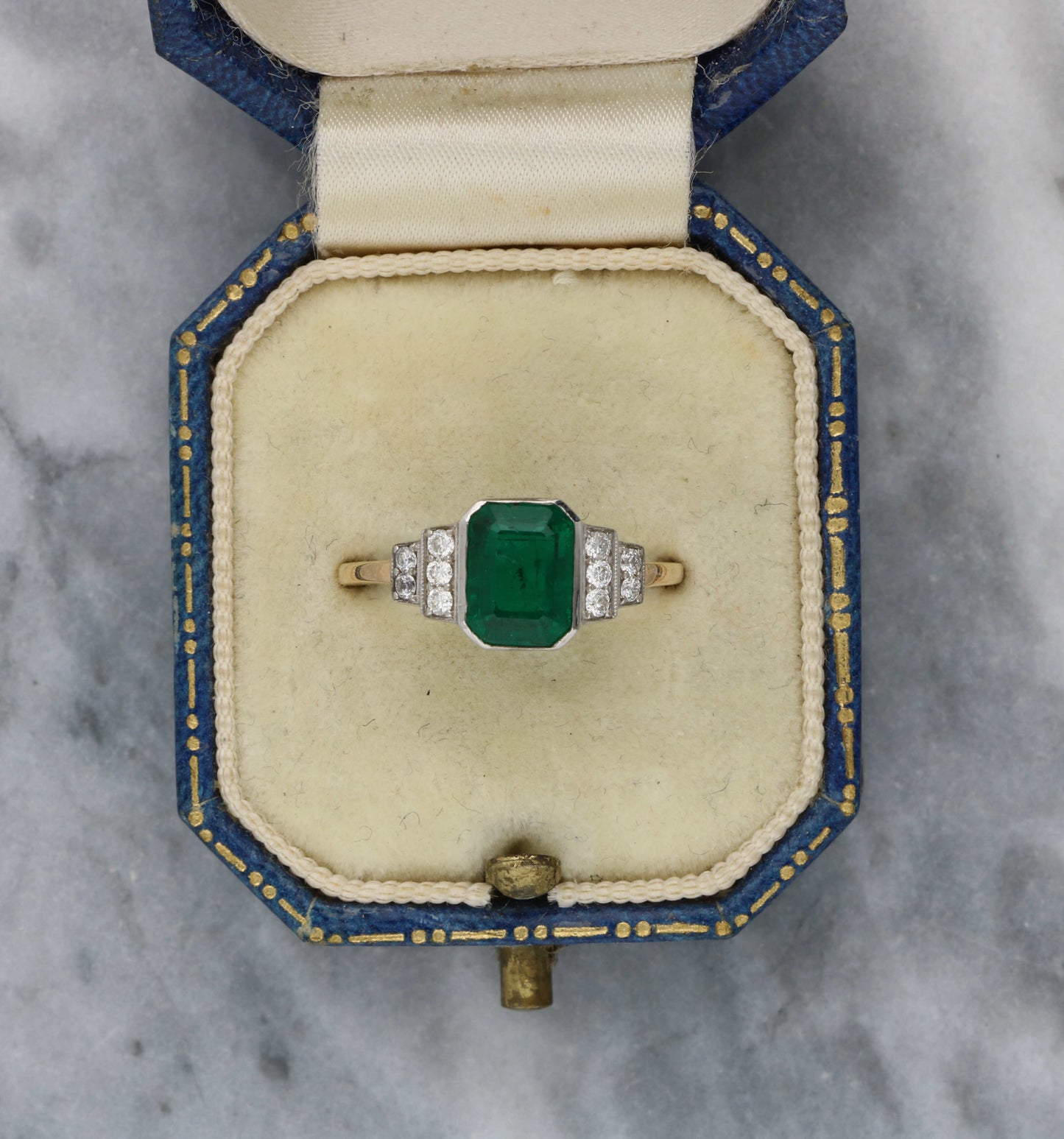18ct rose gold emerald and diamond engagement ring