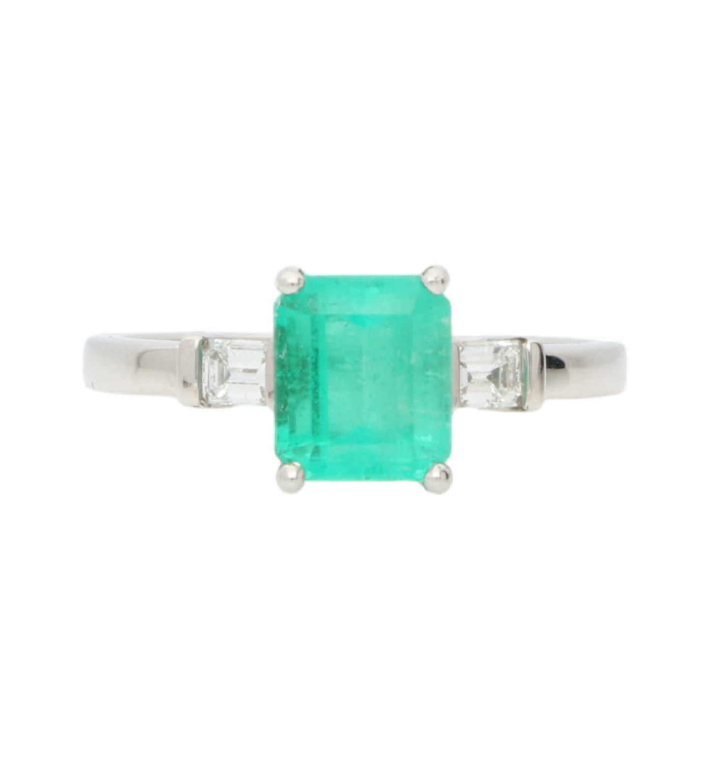 Platinum emerald and diamond engagement ring