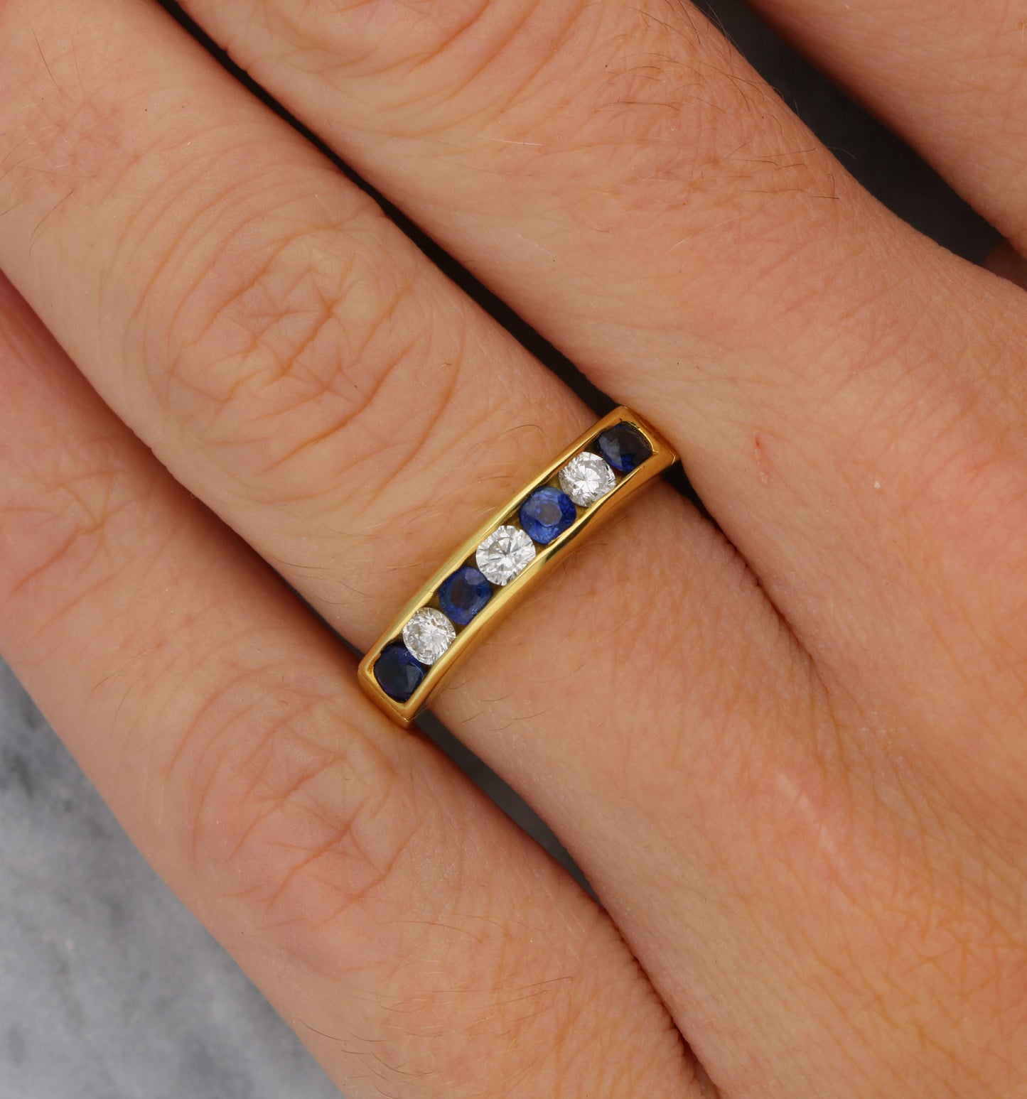 18ct sapphire and diamond half eternity ring