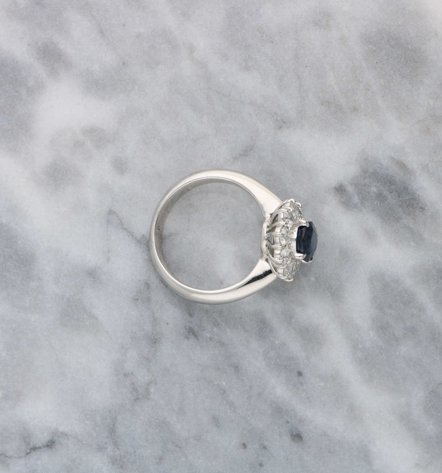 Platinum sapphire and diamond cluster engagement ring