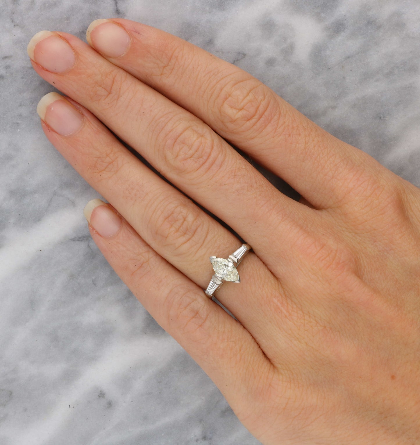 Platinum marquise and tapered baguette diamond engagement ring