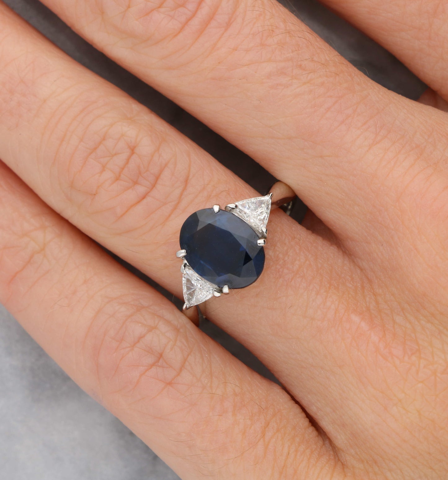 Platinum sapphire and diamond 3 stone engagement ring