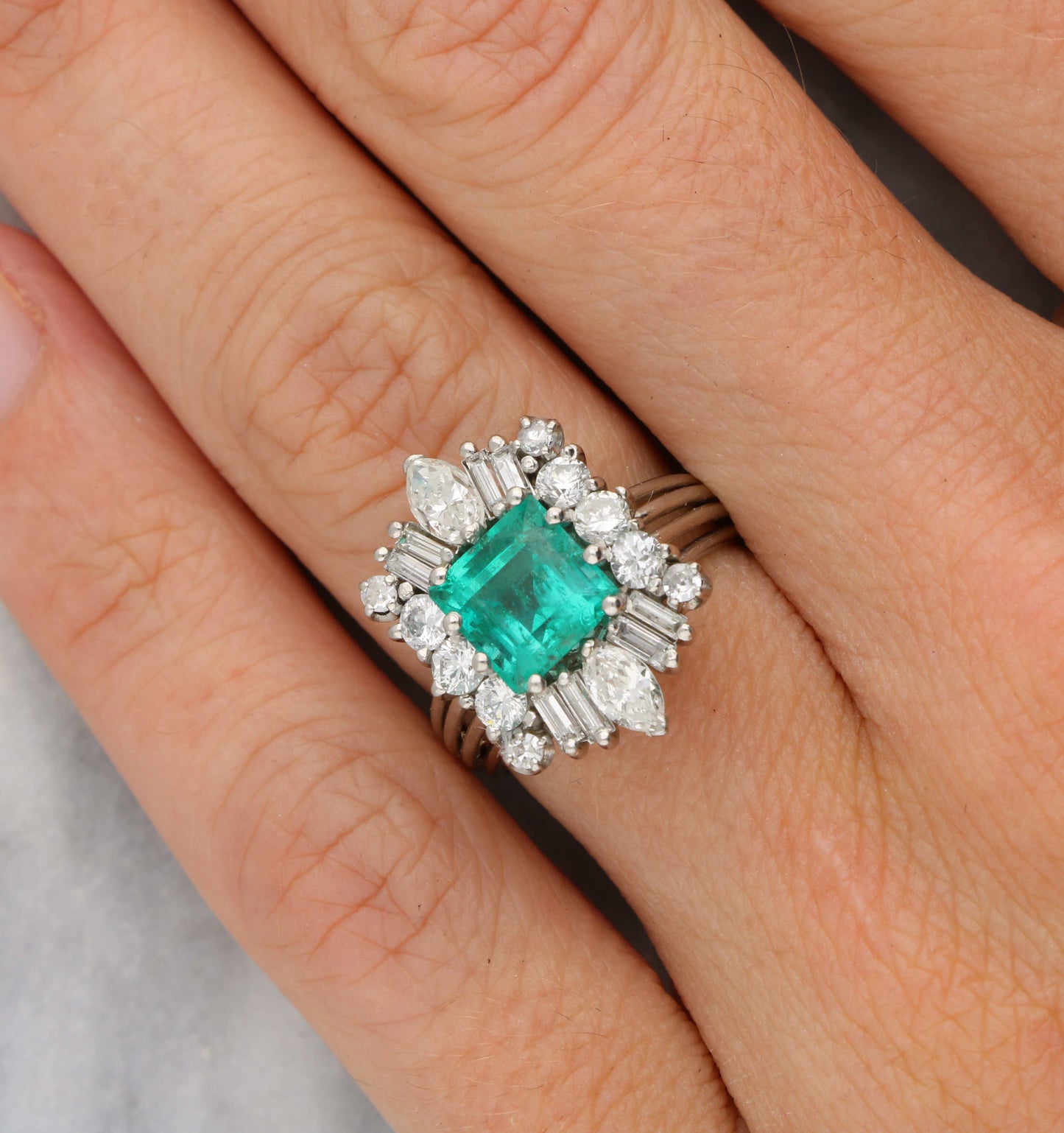 Emerald and diamond cluster ring