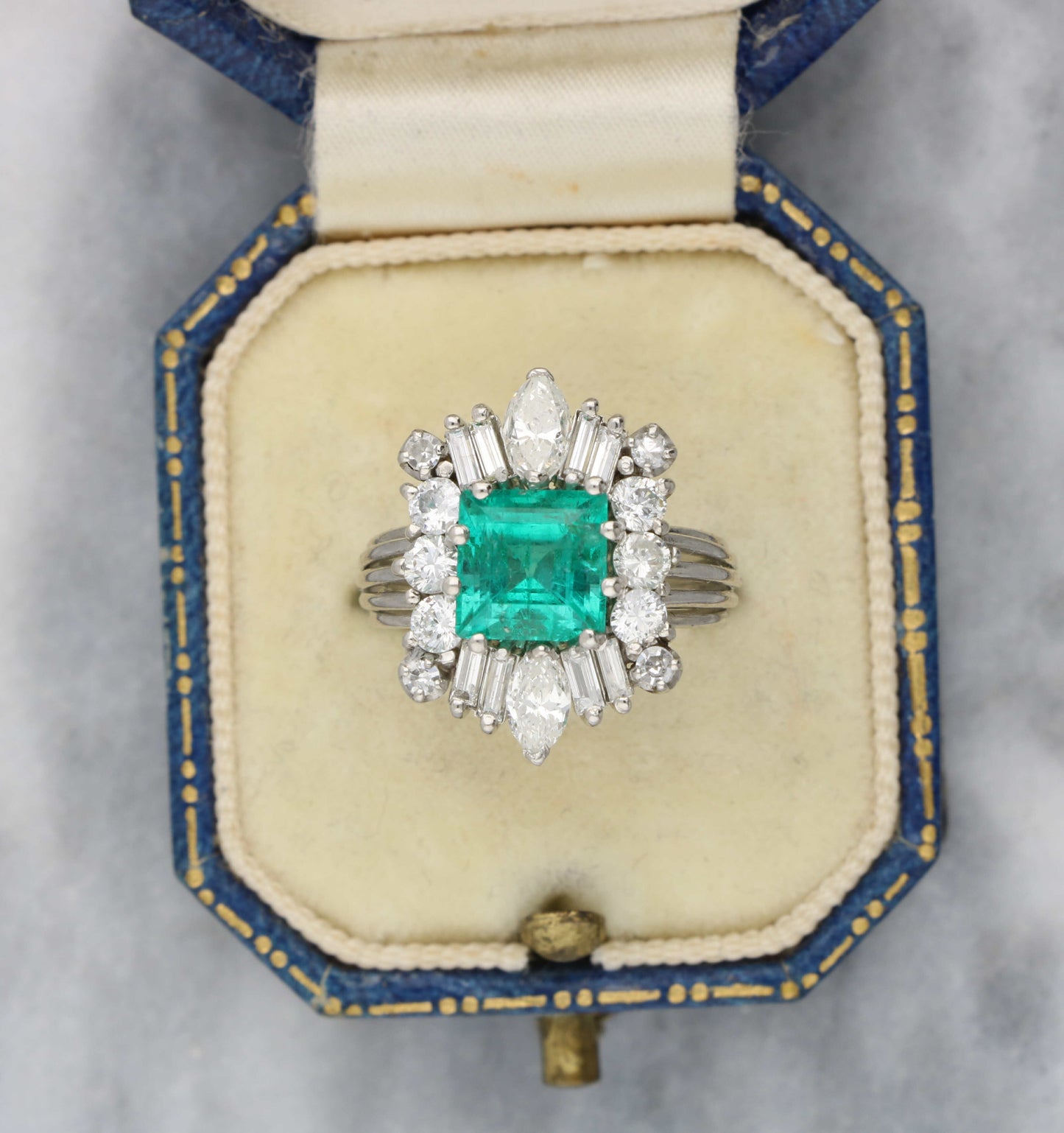 Emerald and diamond cluster ring
