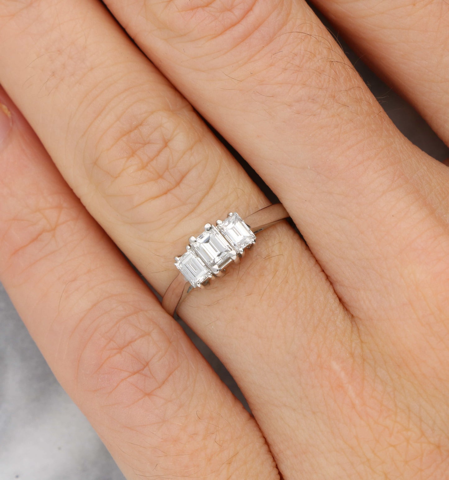 18ct and platinum emerald cut diamond 3 stone engagement ring