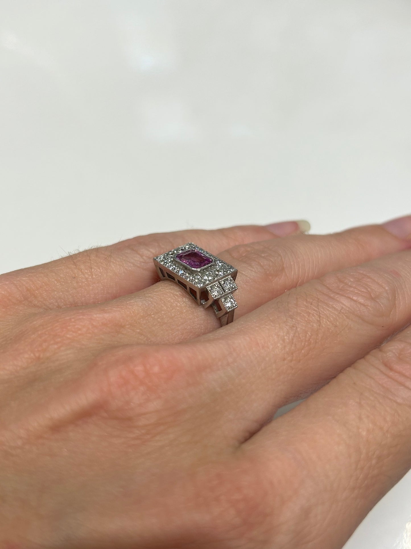 Platinum pink sapphire and diamond ring