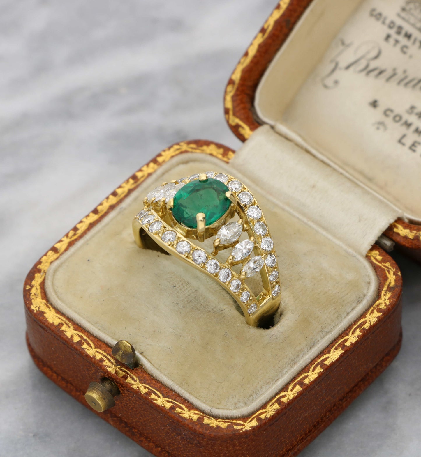 18ct emerald and diamond marquise cluster ring