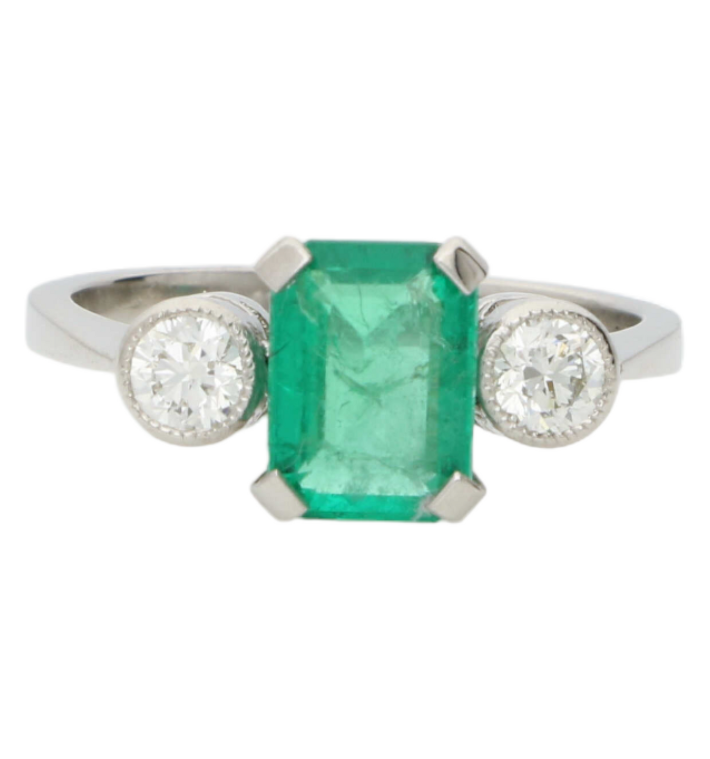 Platinum emerald and diamond 3 stone engagement ring