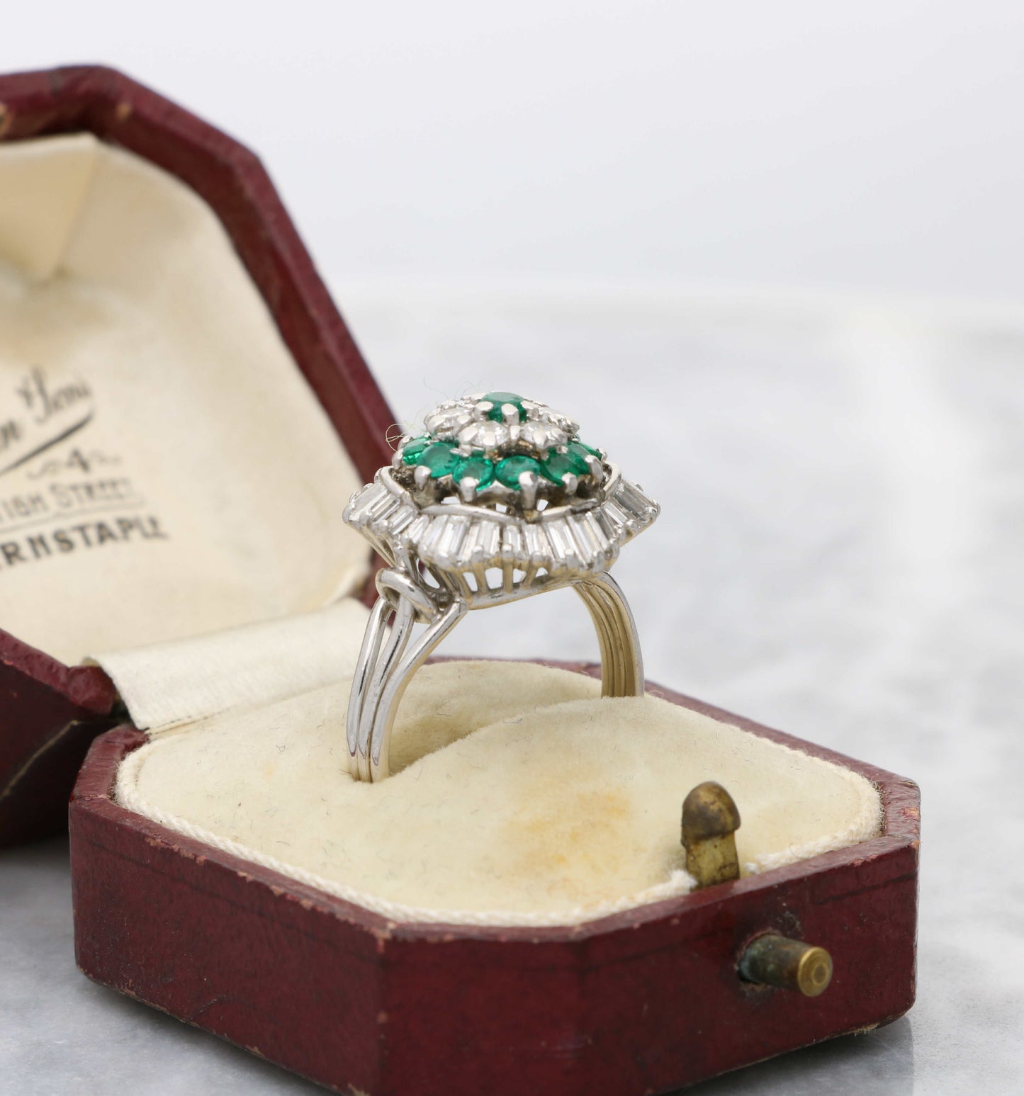 Emerald and diamond cluster ring