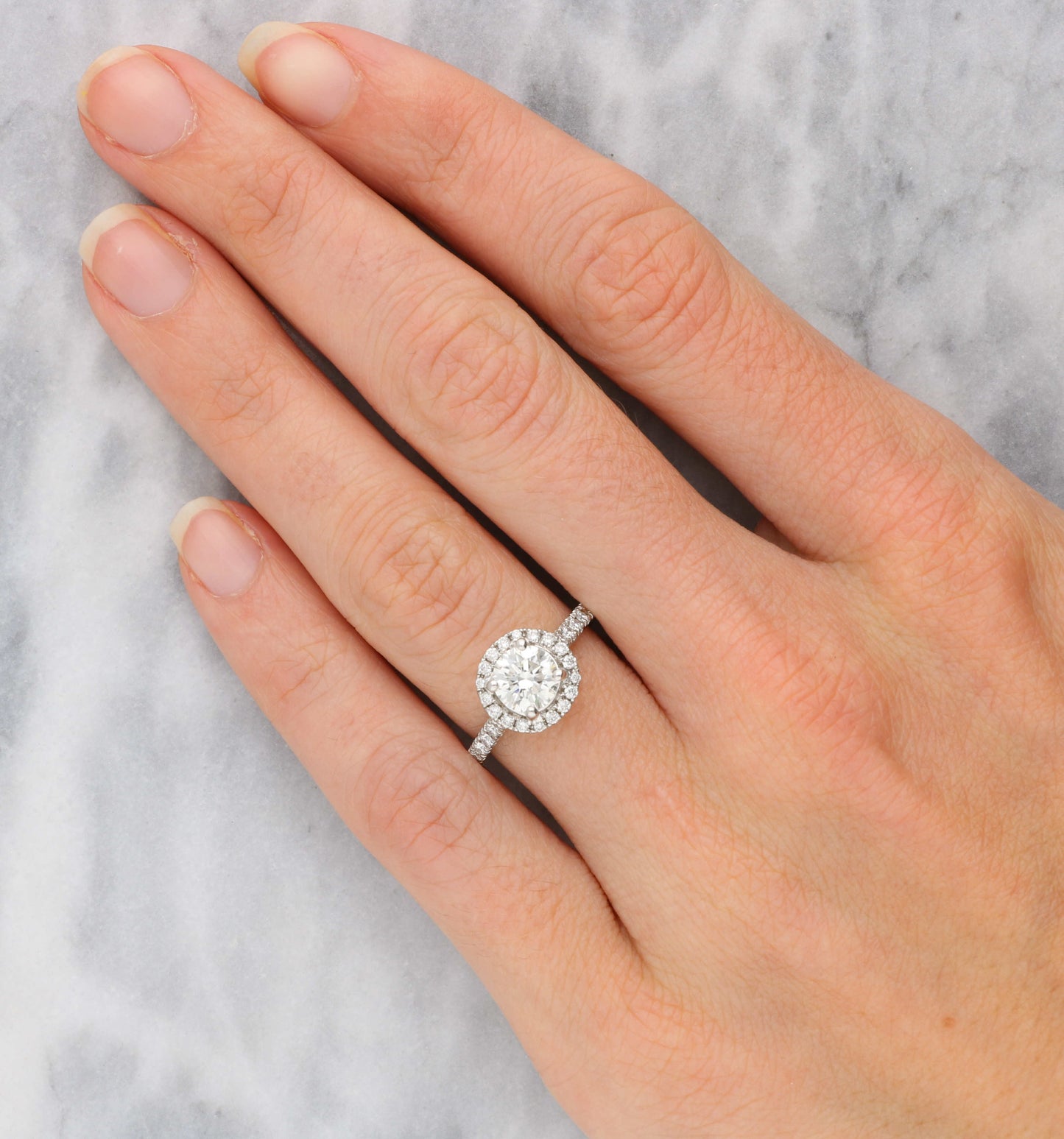 Platinum 1.10ct diamond halo engagement ring