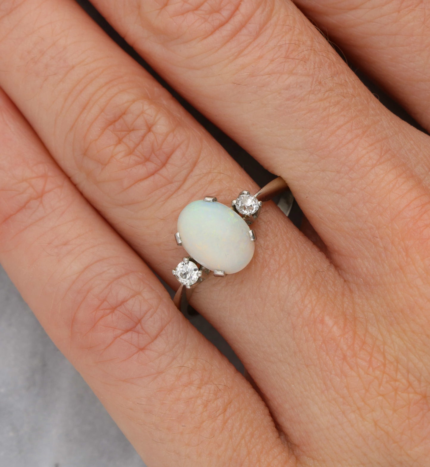 Platinum opal and old cut diamond 3 stone ring