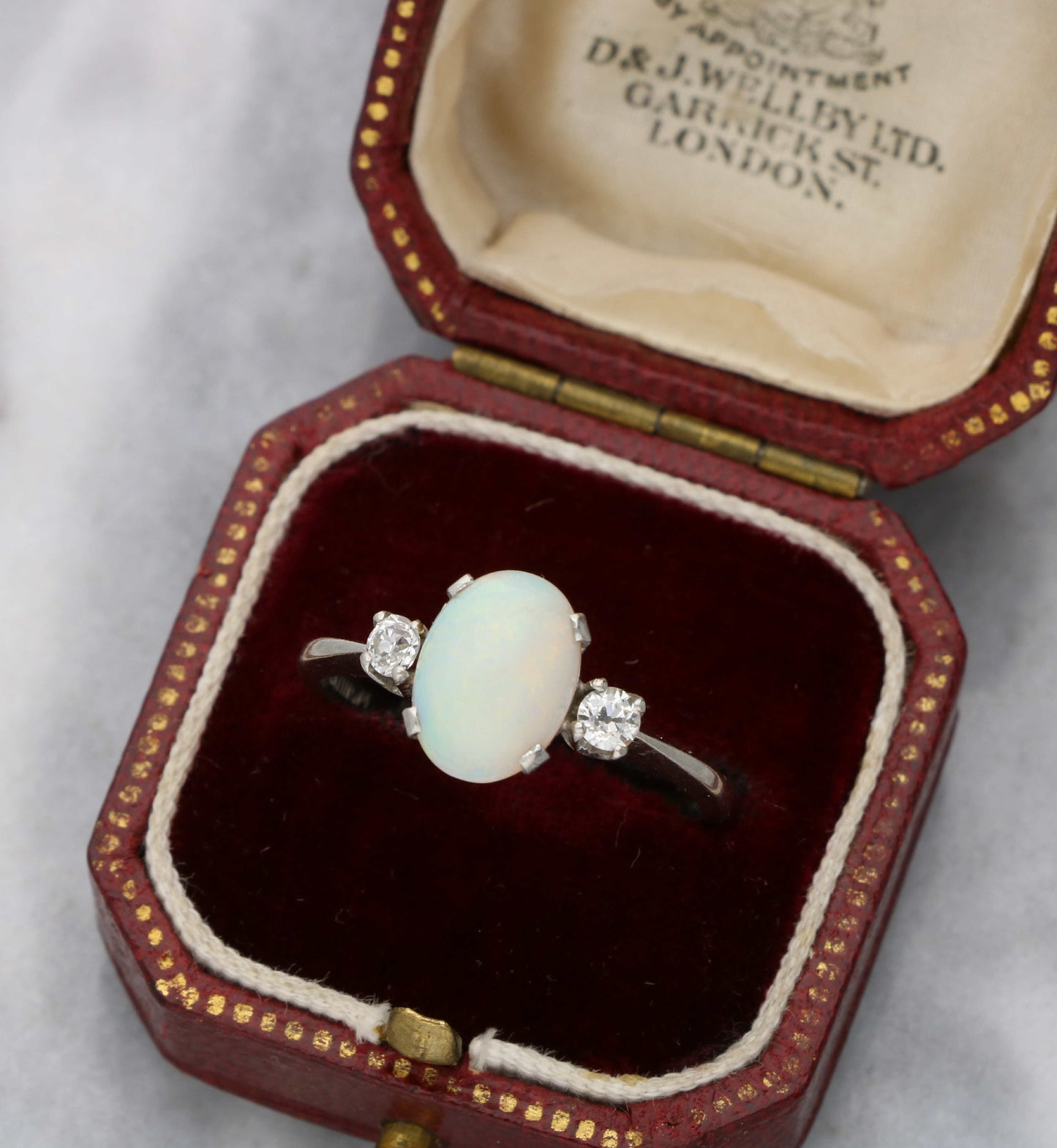 Platinum opal and old cut diamond 3 stone ring