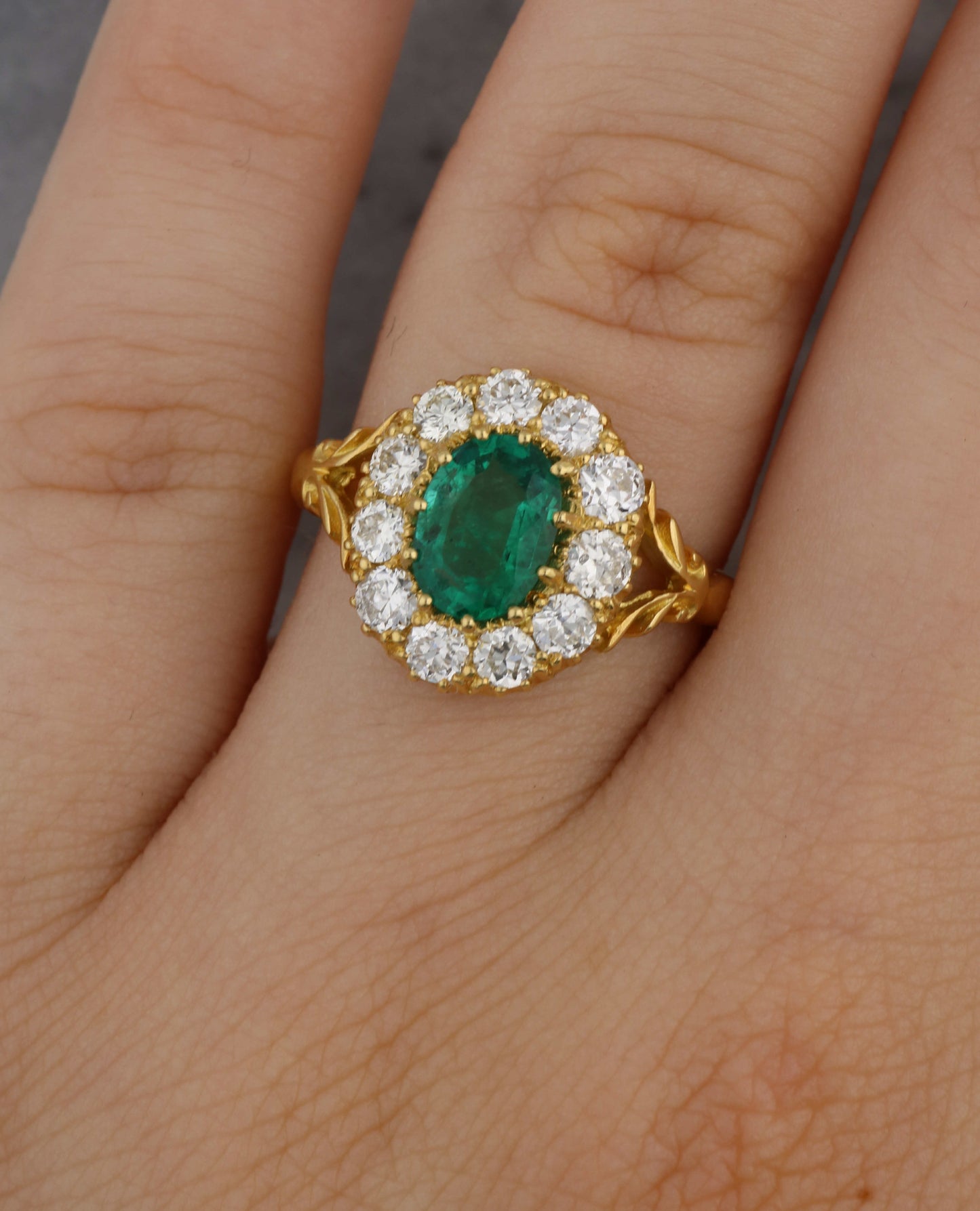 18ct emerald and diamond cluster ring