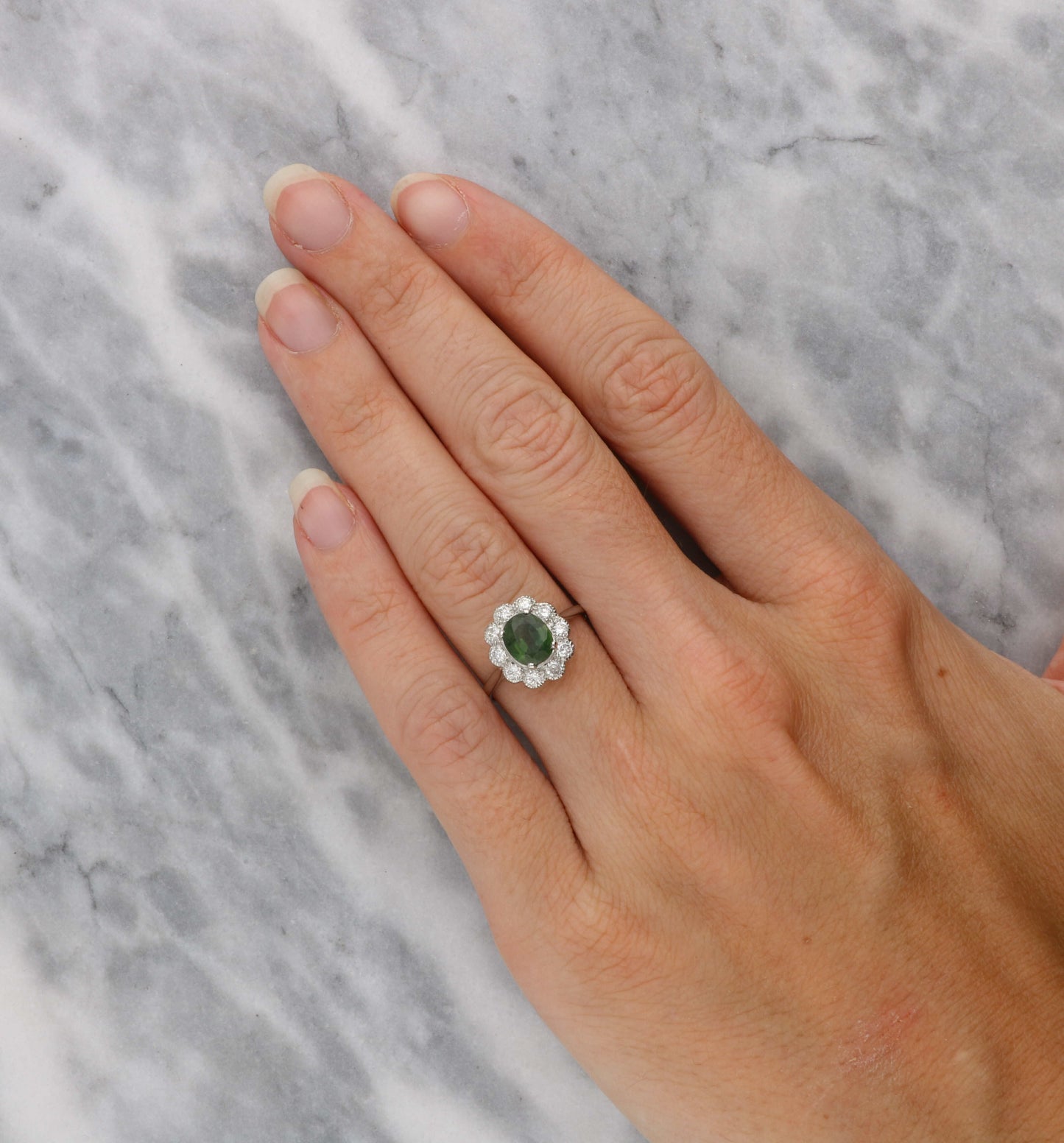 Platinum green sapphire and diamond cluster ring