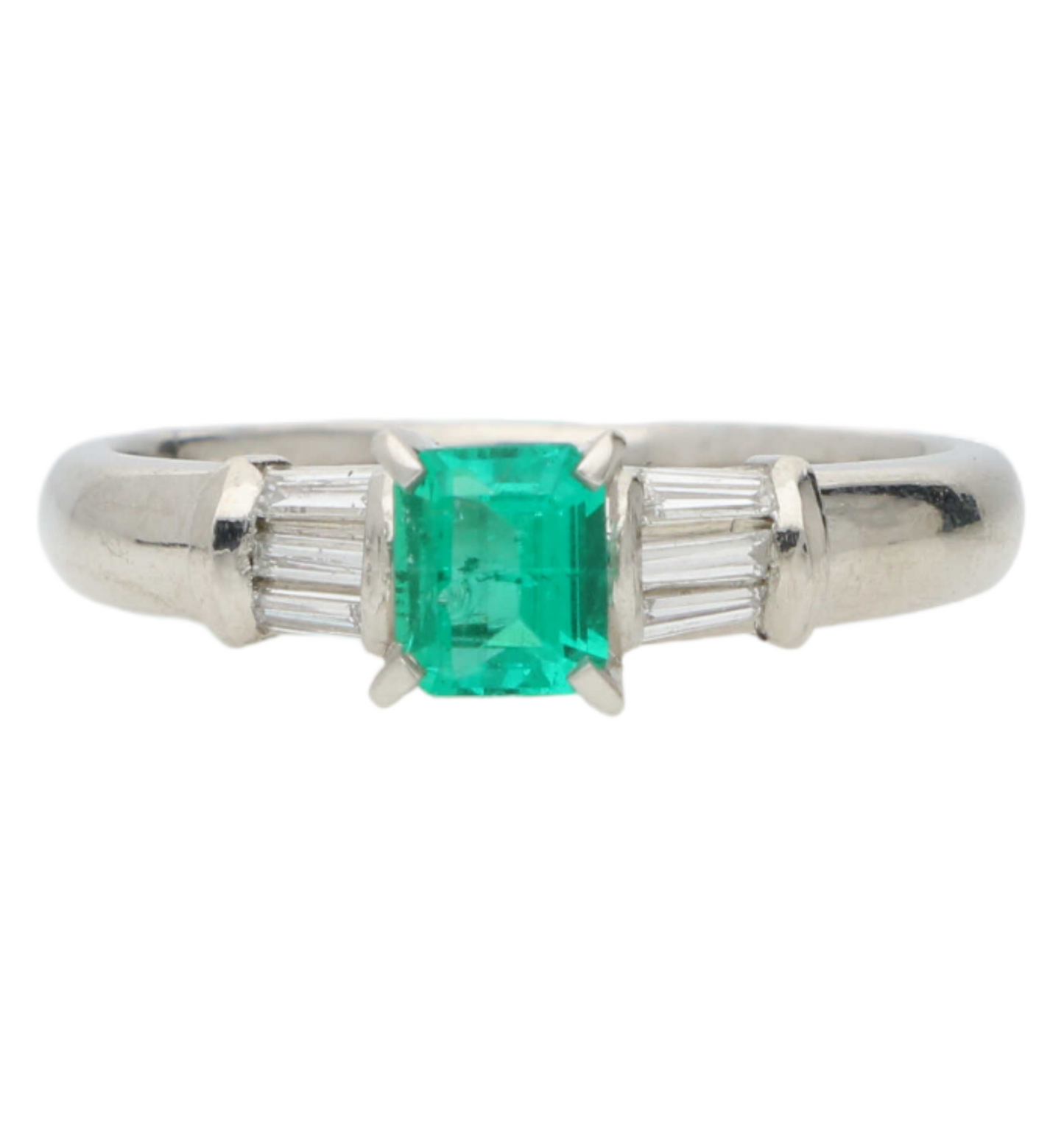 Platinum emerald and baguette diamond engagement ring