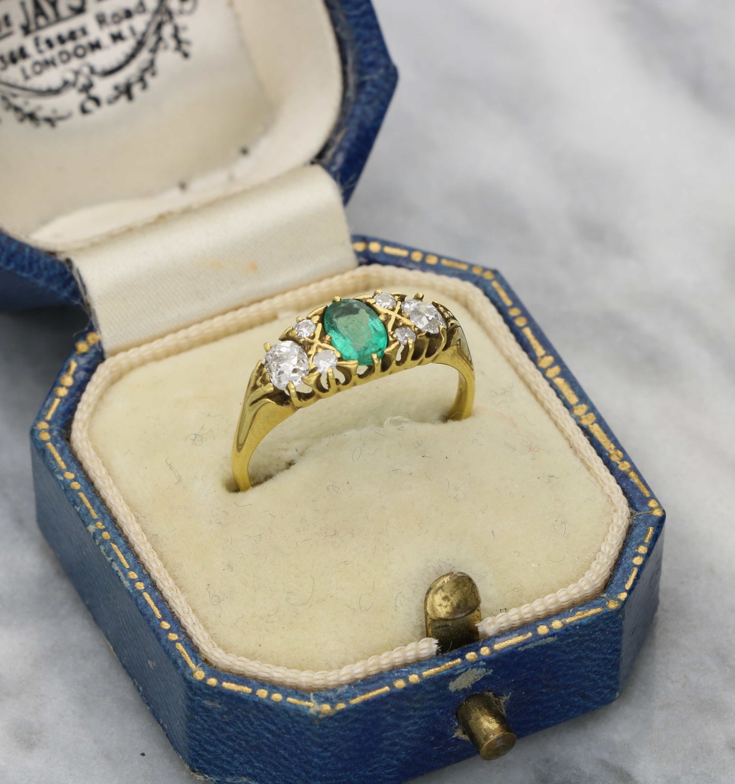 18ct emerald and old cut diamond carved ring