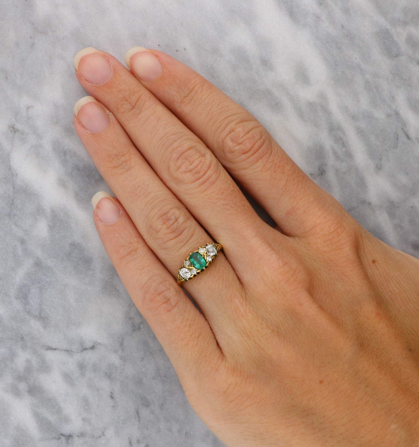 18ct emerald and old cut diamond carved ring