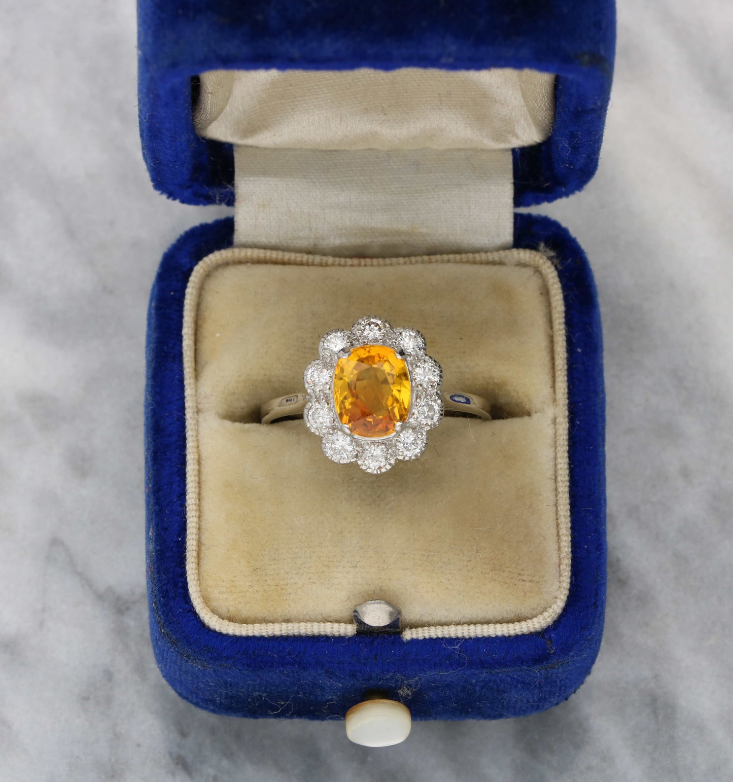 Platinum orange sapphire and diamond cluster ring