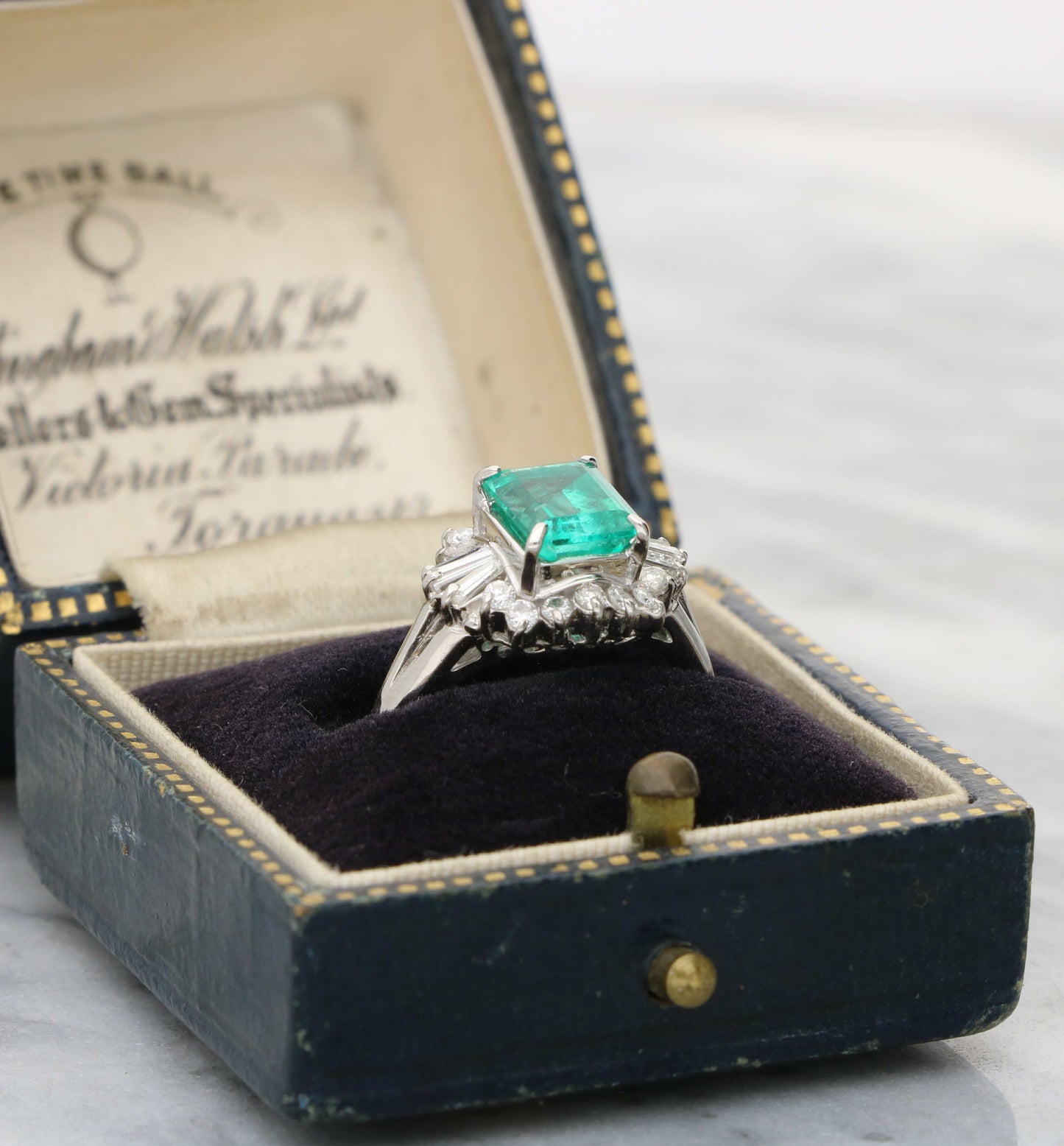 Platinum emerald and diamond cluster ring