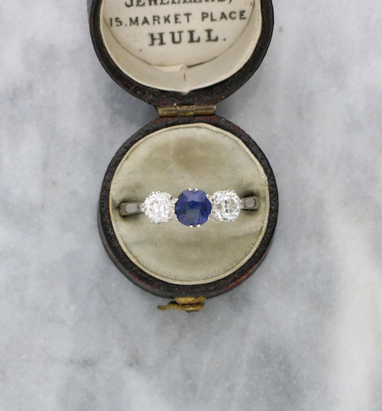 Platinum sapphire and old cut diamond 3 stone engagement ring