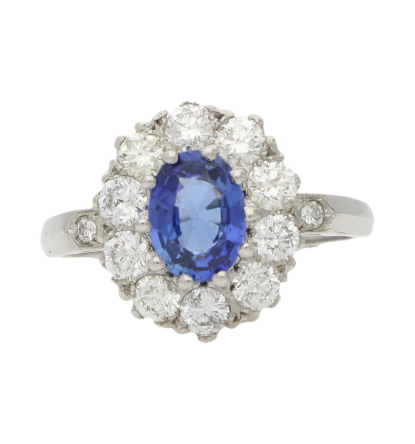 Platinum sapphire and diamond cluster engagement ring