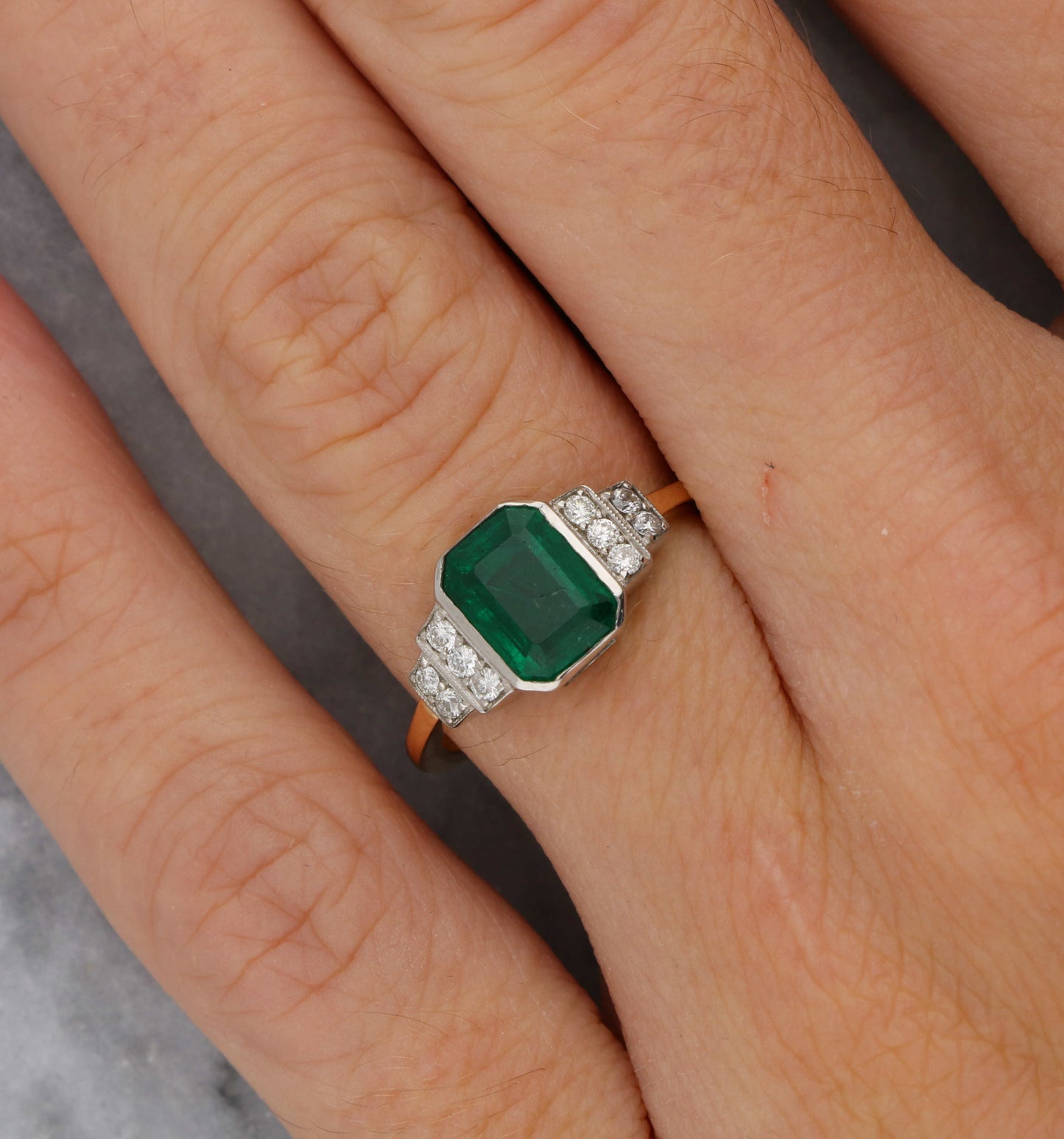 18ct rose gold emerald and diamond engagement ring