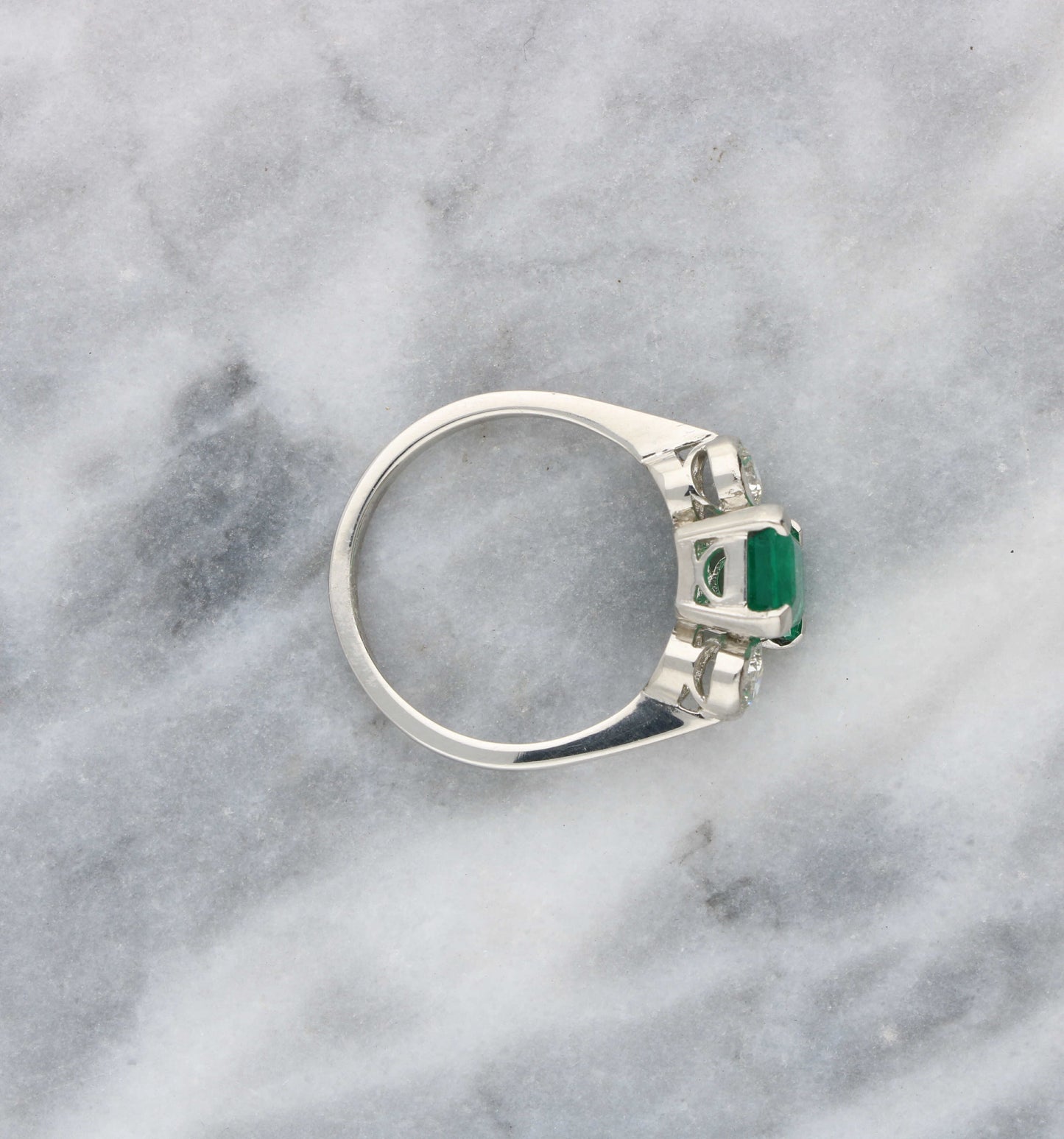 Platinum emerald and diamond 3 stone engagement ring