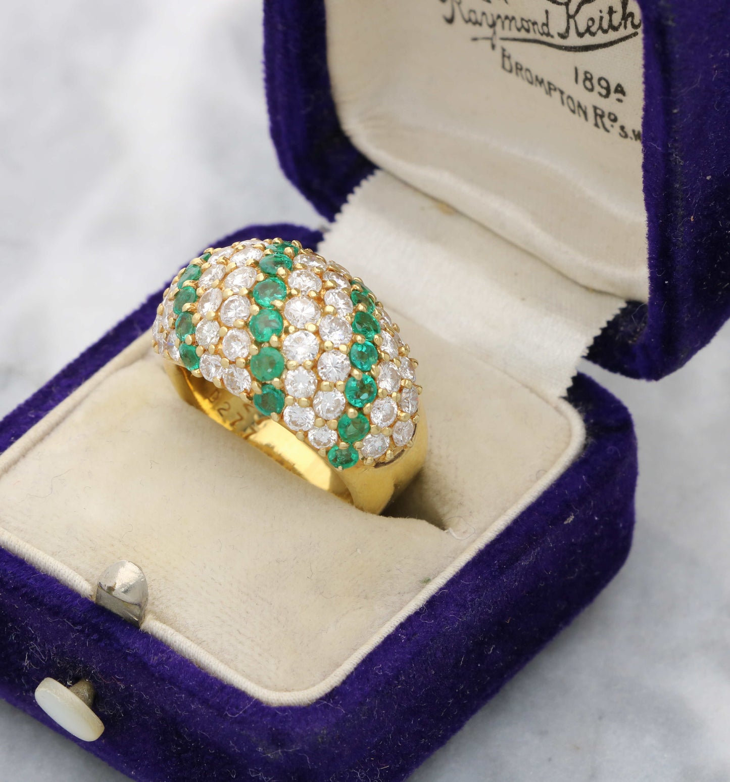 18ct emerald and diamond bombe ring