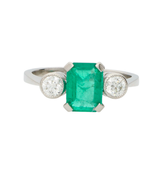 Platinum emerald and diamond 3 stone engagement ring