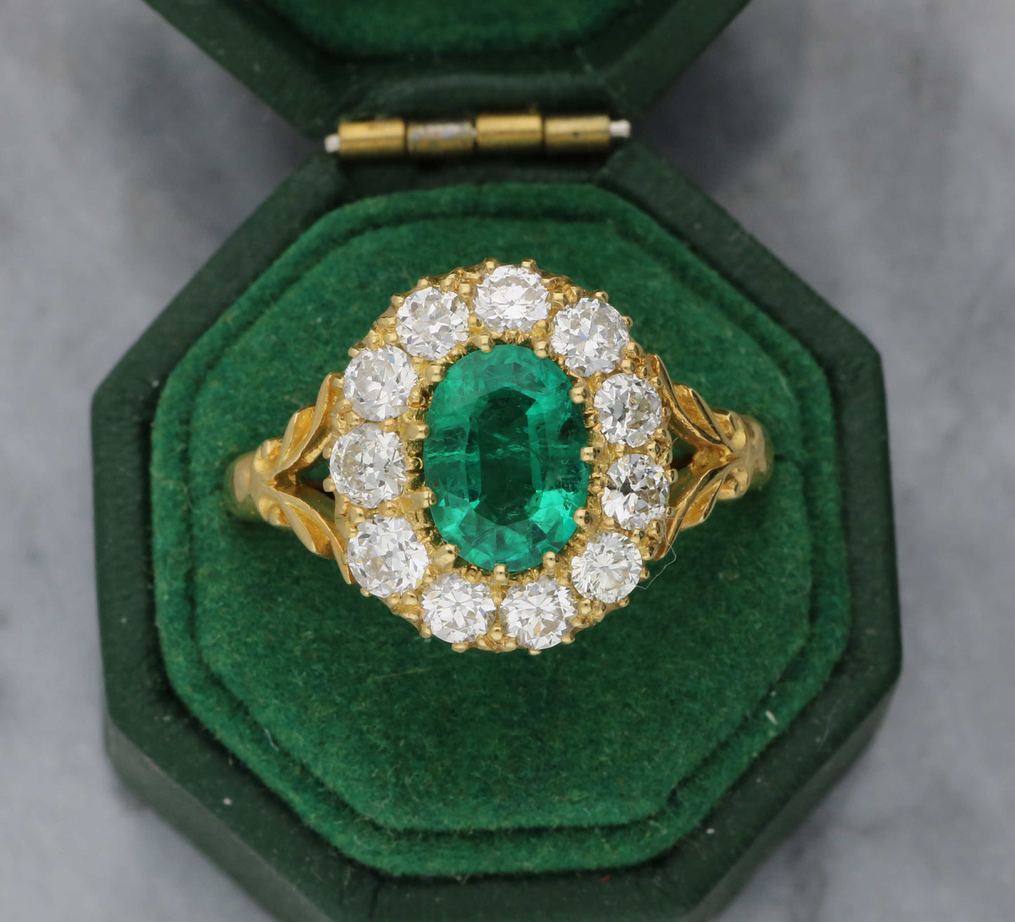 18ct emerald and diamond cluster ring
