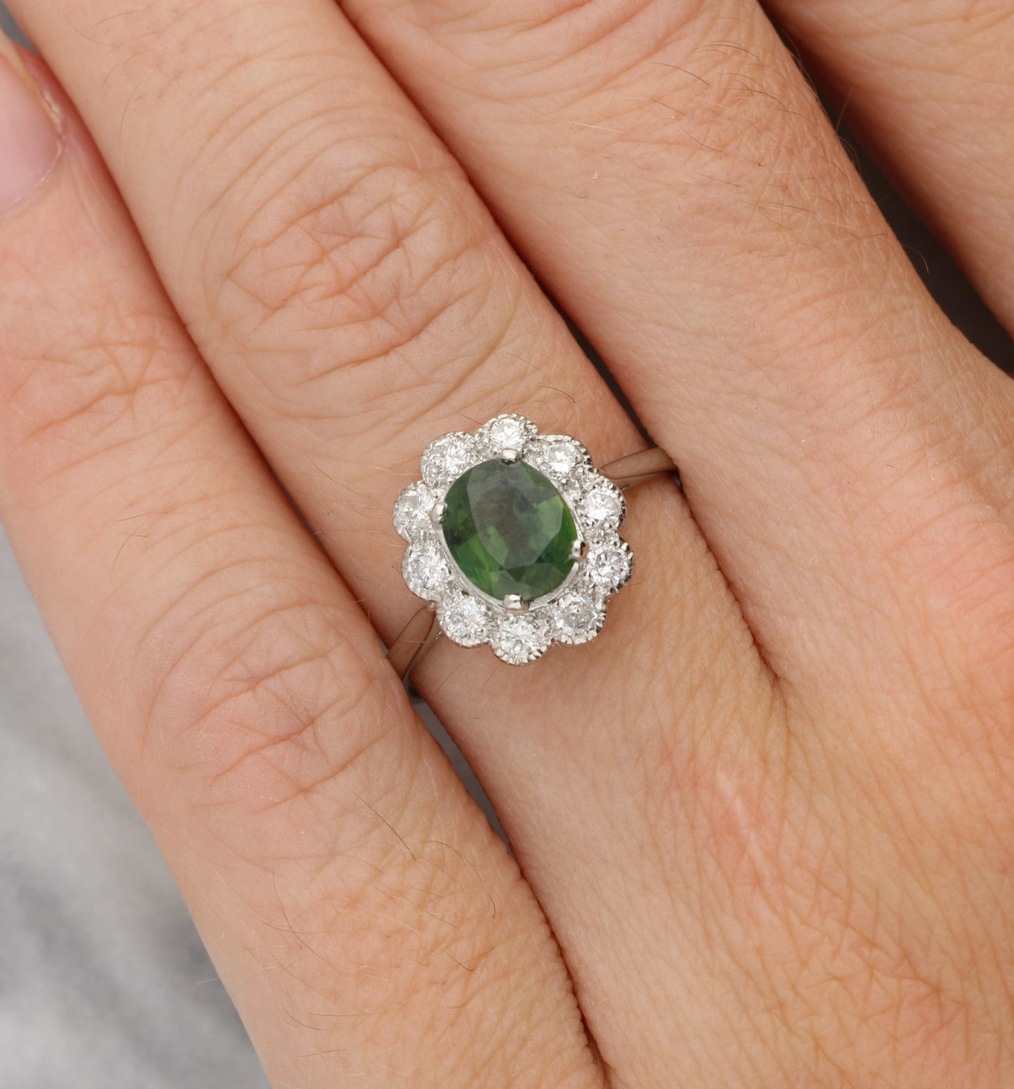 Platinum green sapphire and diamond cluster ring