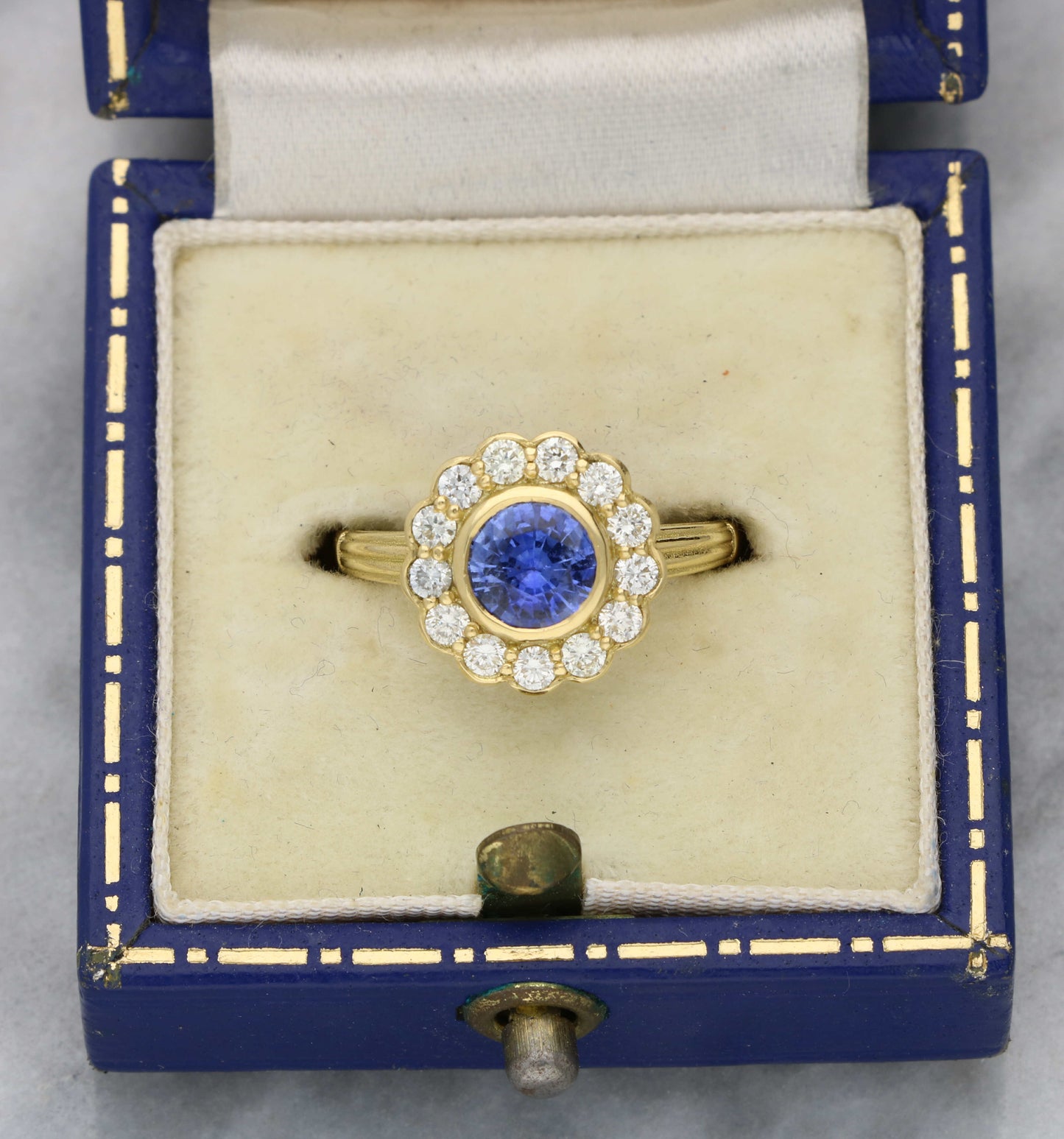 18ct sapphire and diamond cluster engagement ring
