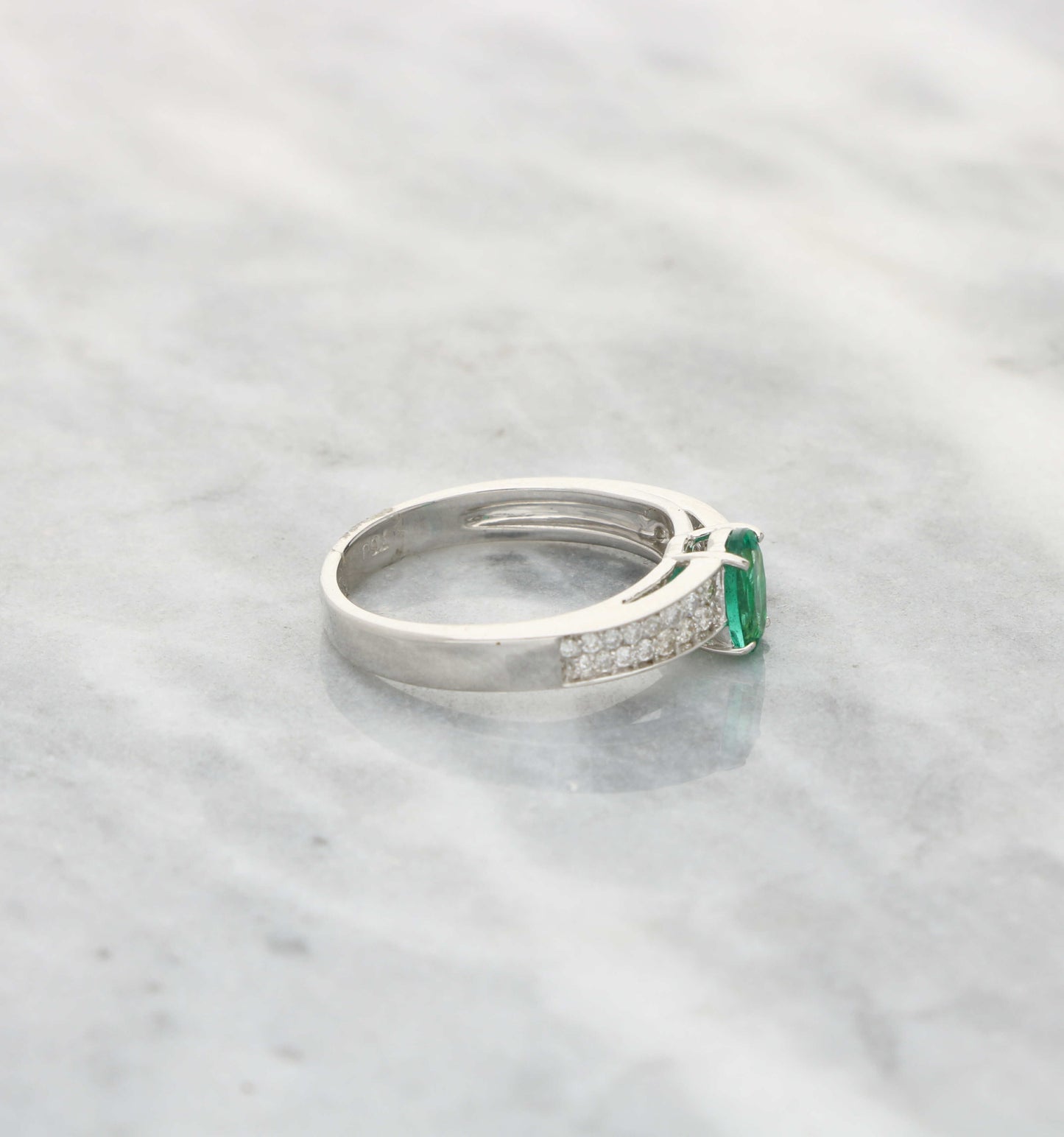 18ct 0.52ct emerald and diamond ring