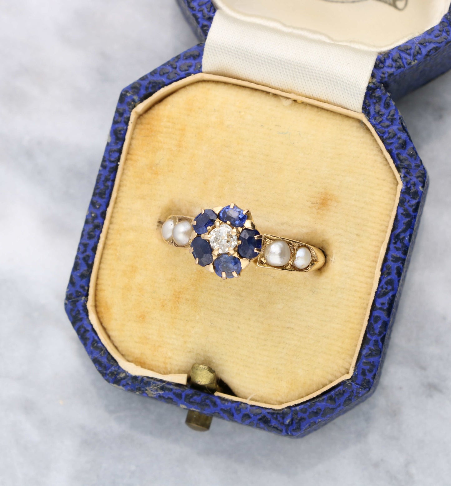Old cut diamond, sapphire and pearl cluster ring
