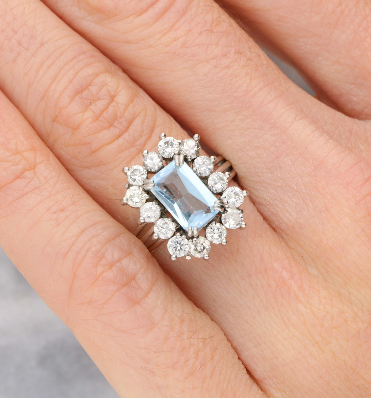 Blue topaz and diamond cluster ring