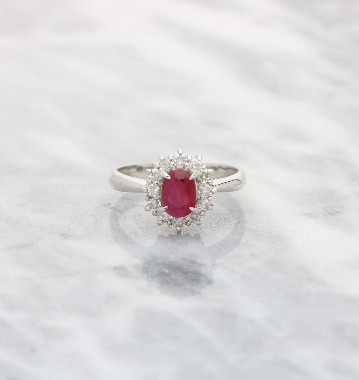 Platinum ruby and diamond cluster engagement ring