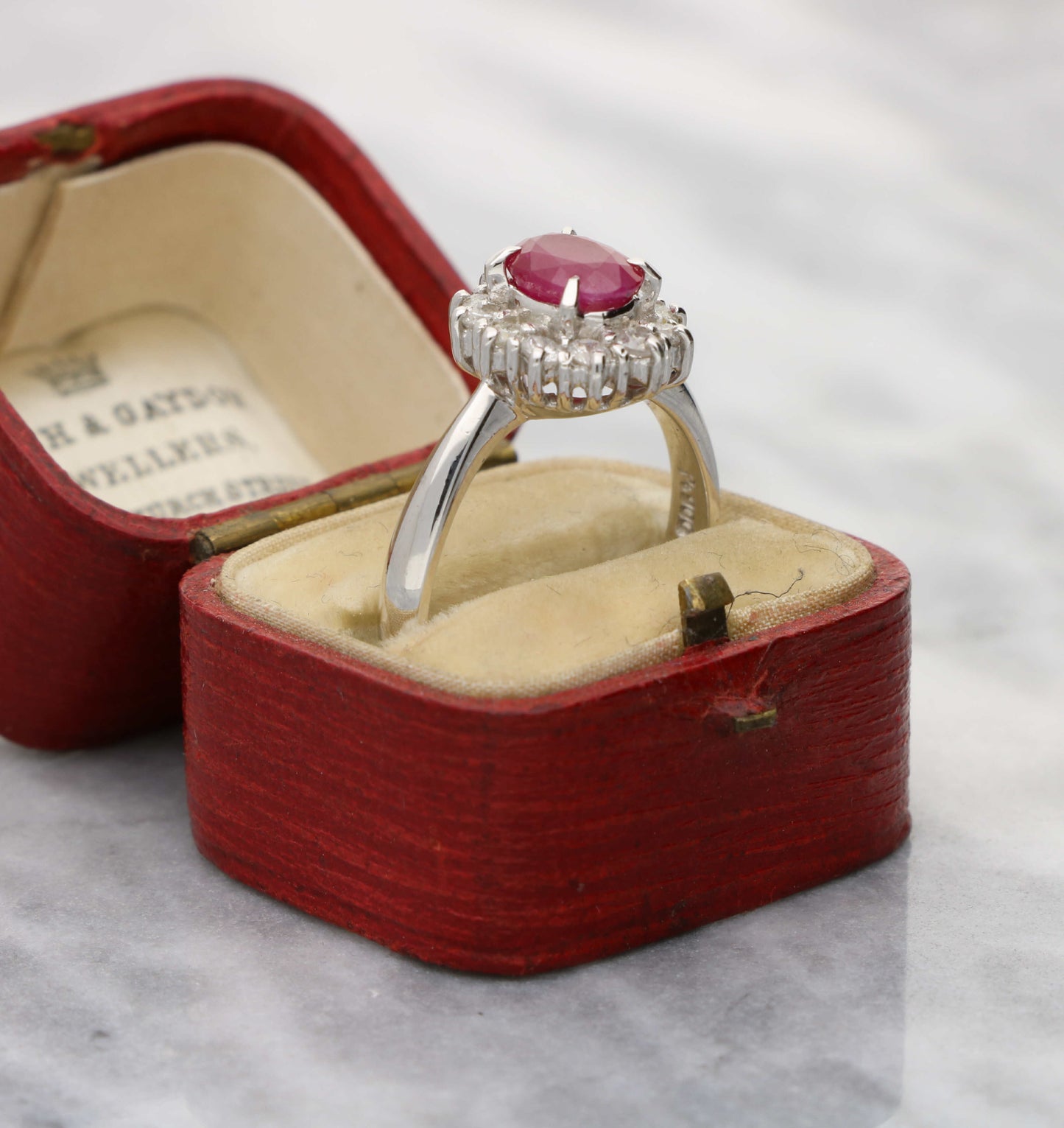 Platinum ruby and diamond cluster engagement ring