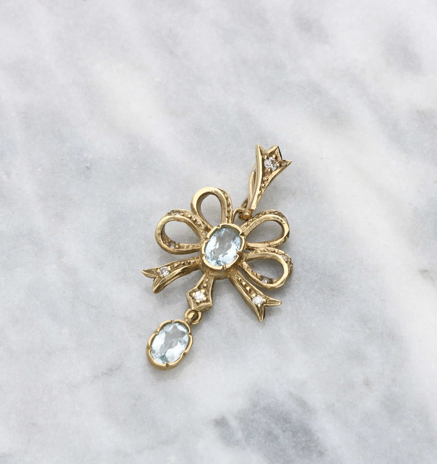 9ct aquamarine and diamond bow pendant