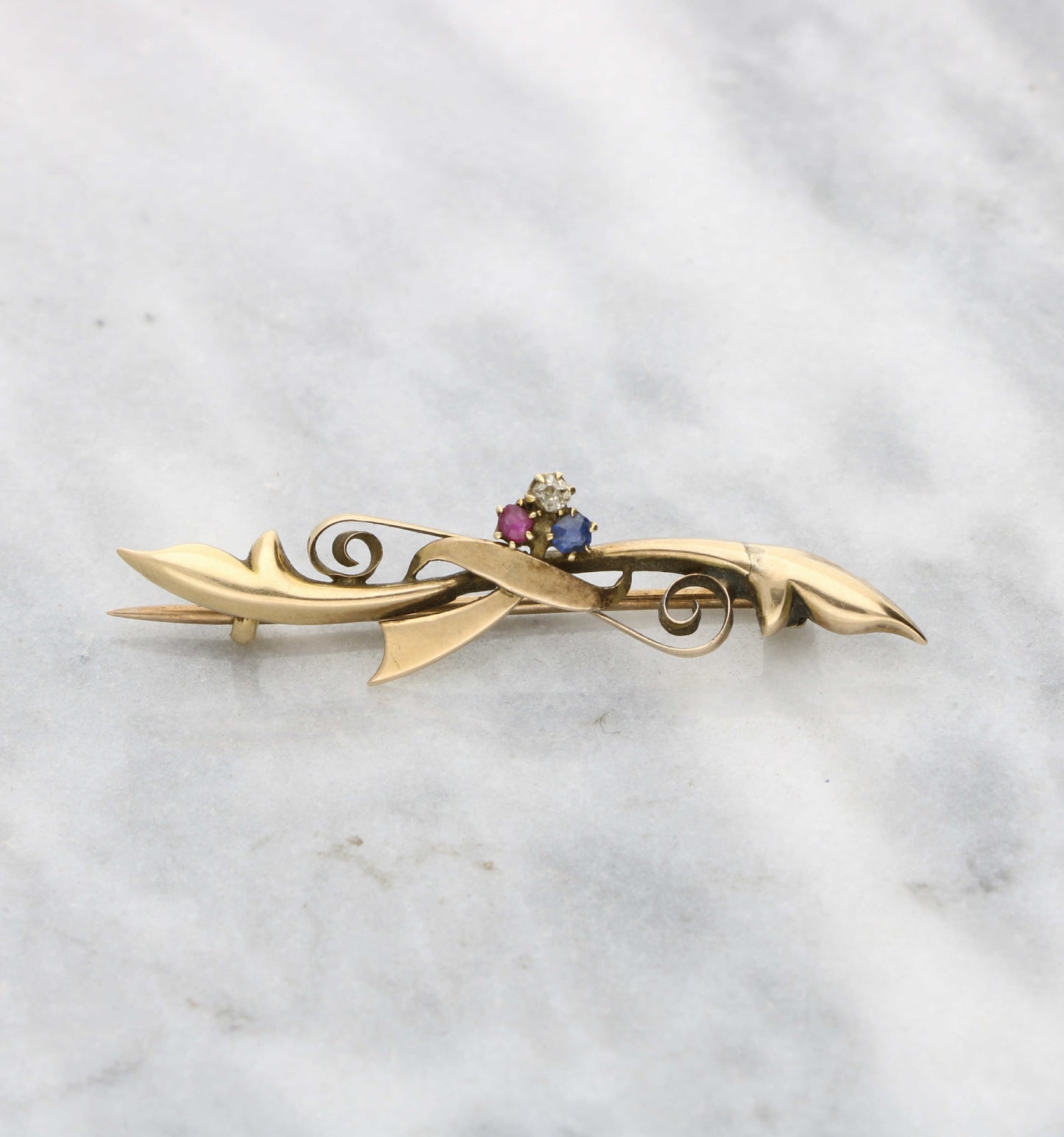 Diamond, ruby and sapphire rose gold brooch