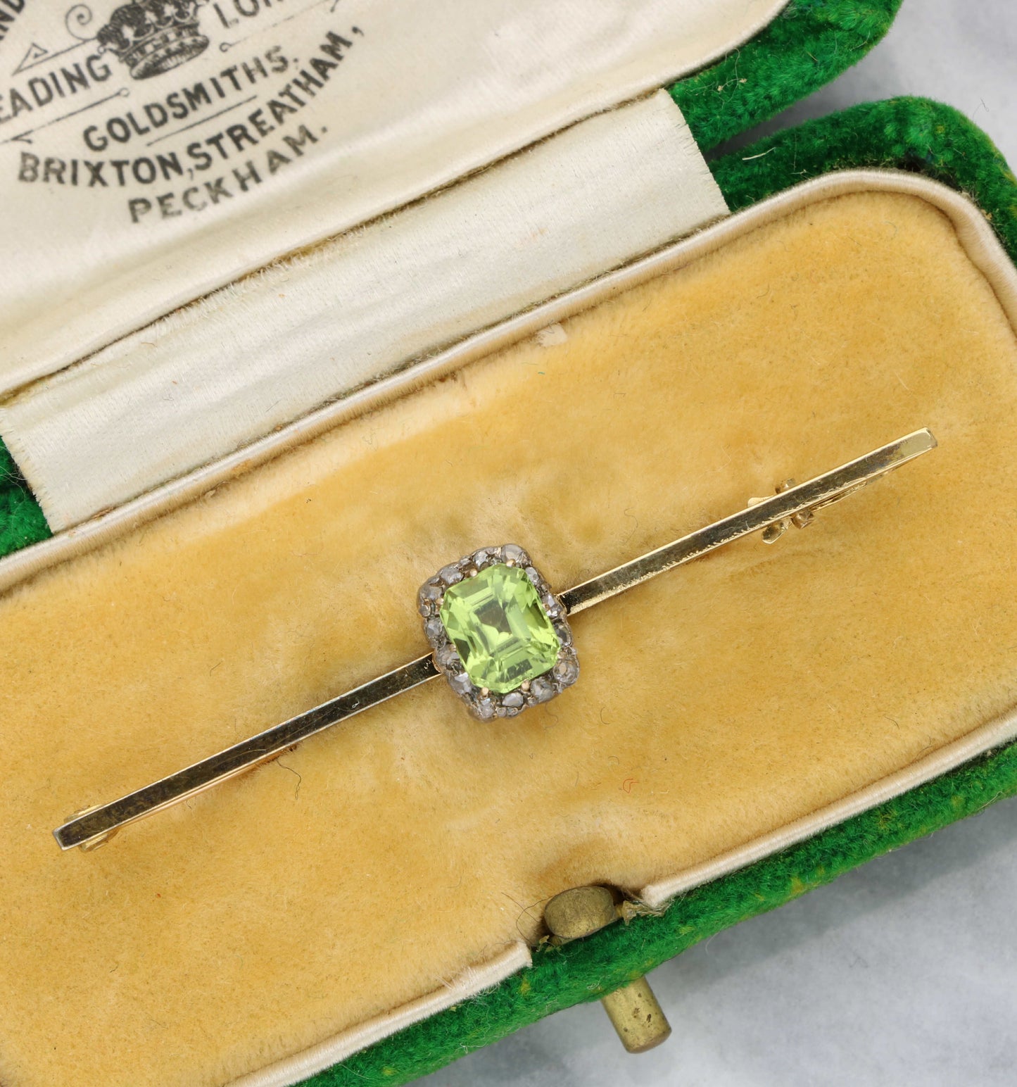 Peridot and rose-cut diamond brooch