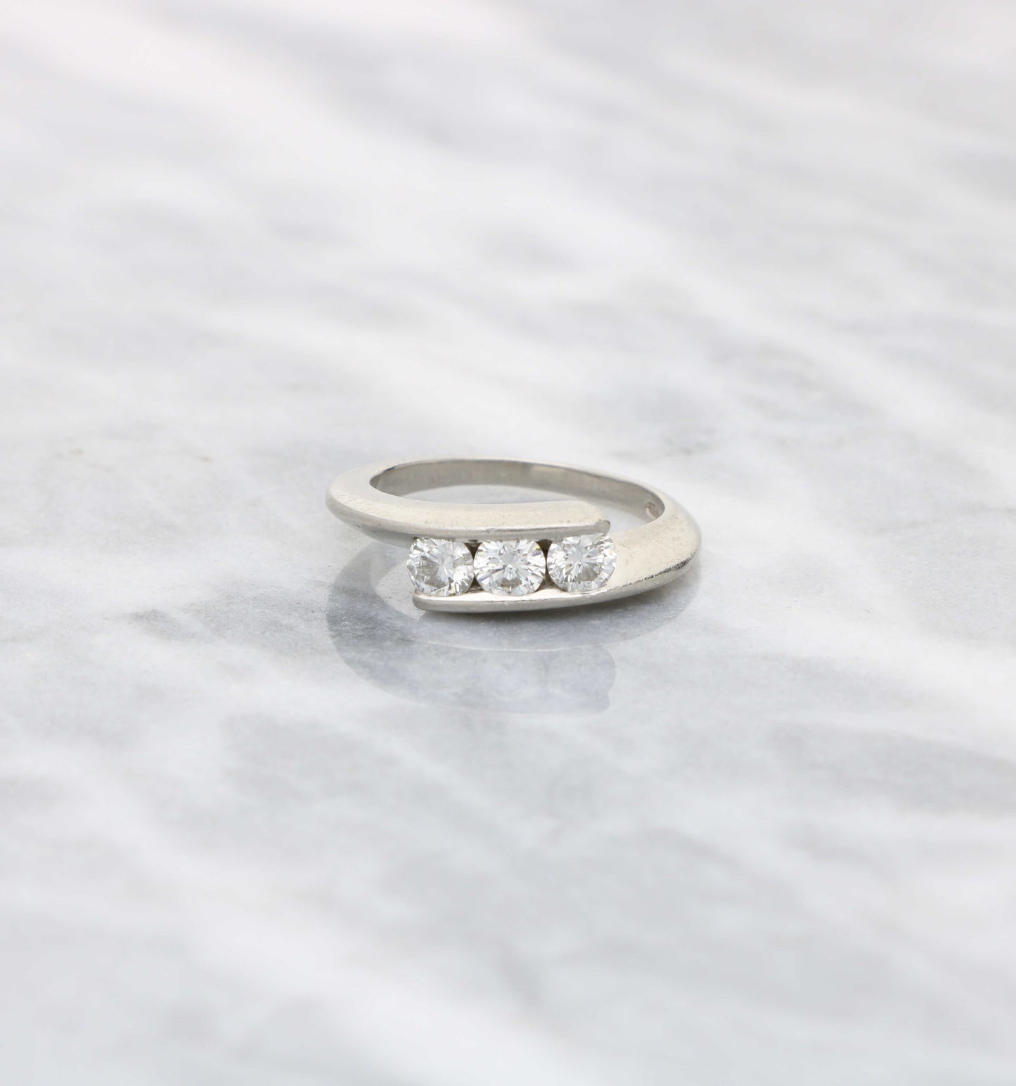 Platinum 3-stone diamond crossover ring