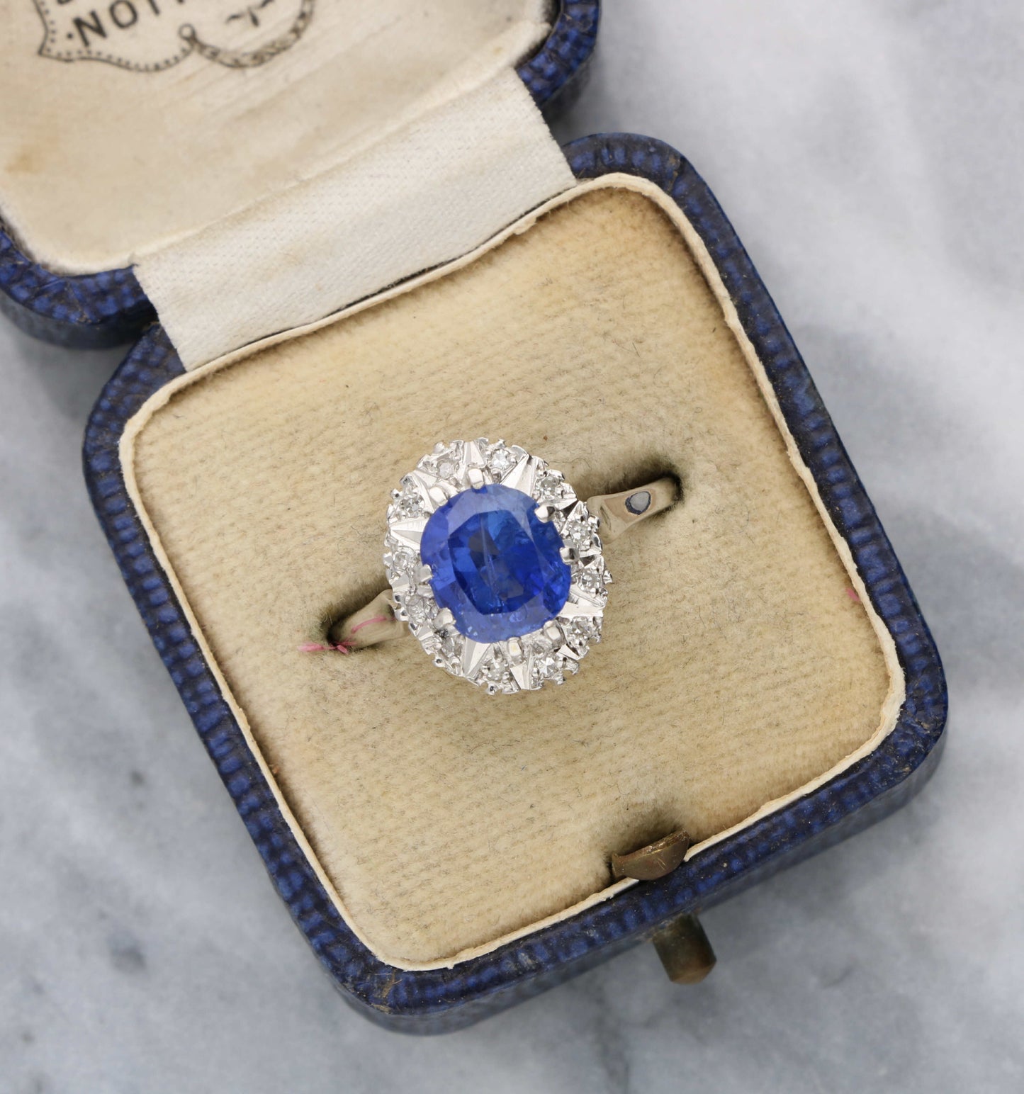 Ceylon Sapphire and diamond cluster engagement ring