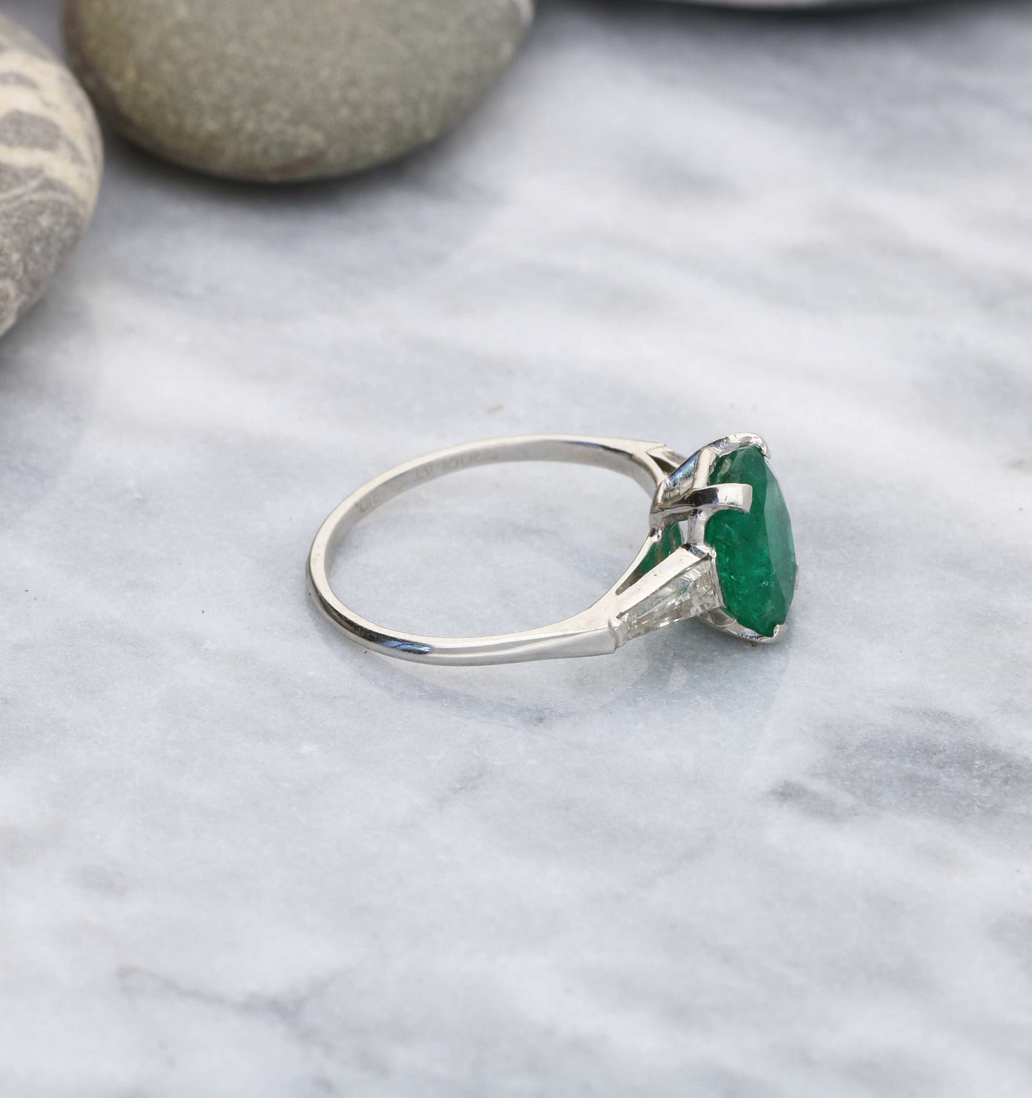 Platinum emerald and diamond engagement ring